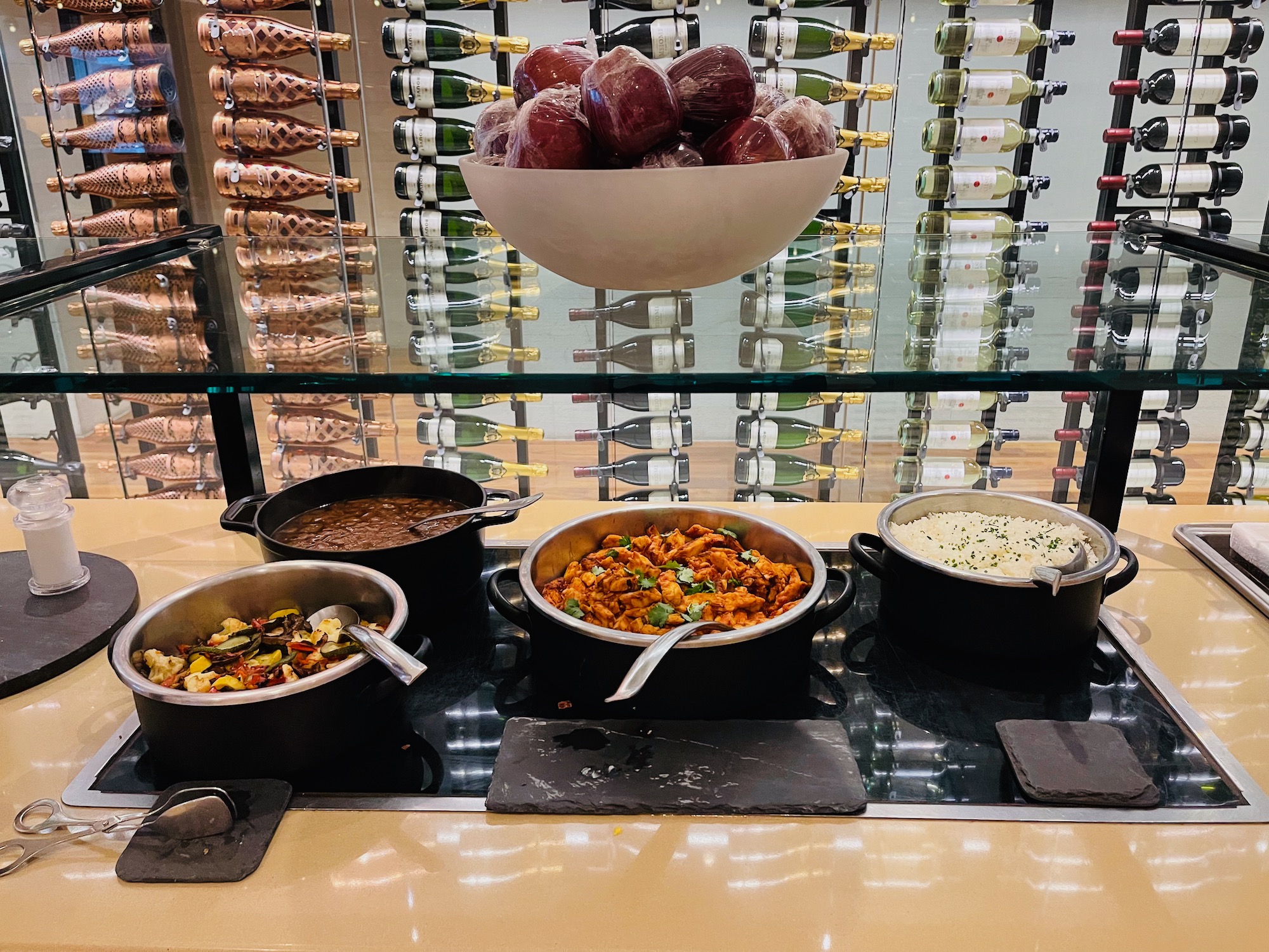 a group of pots of food on a counter