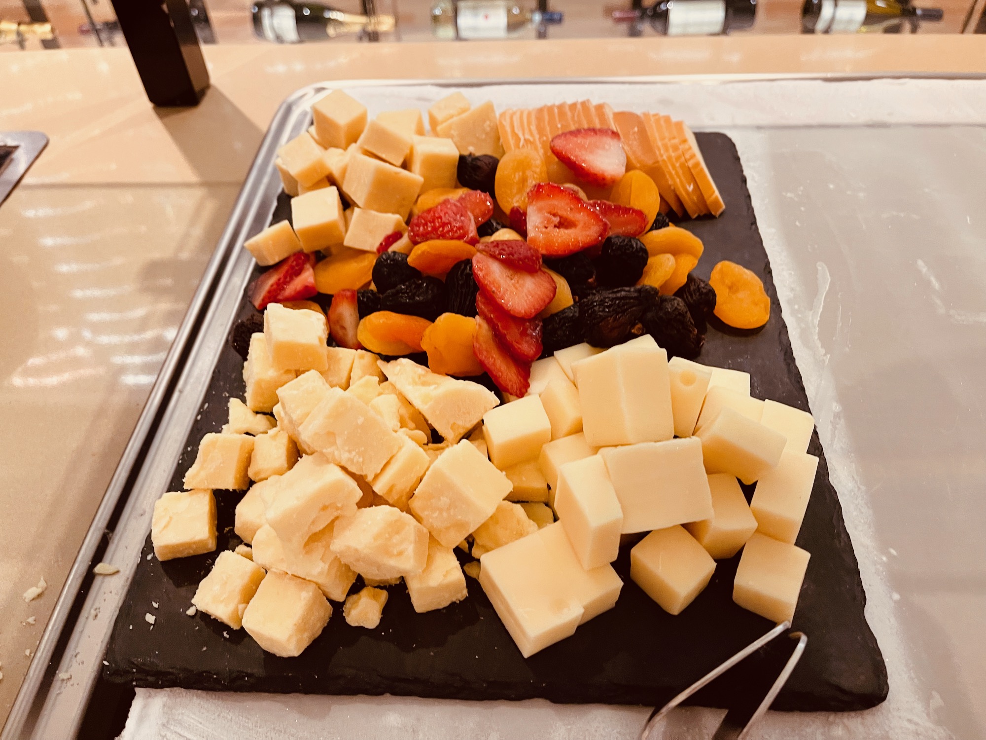 a tray of cheese and fruit