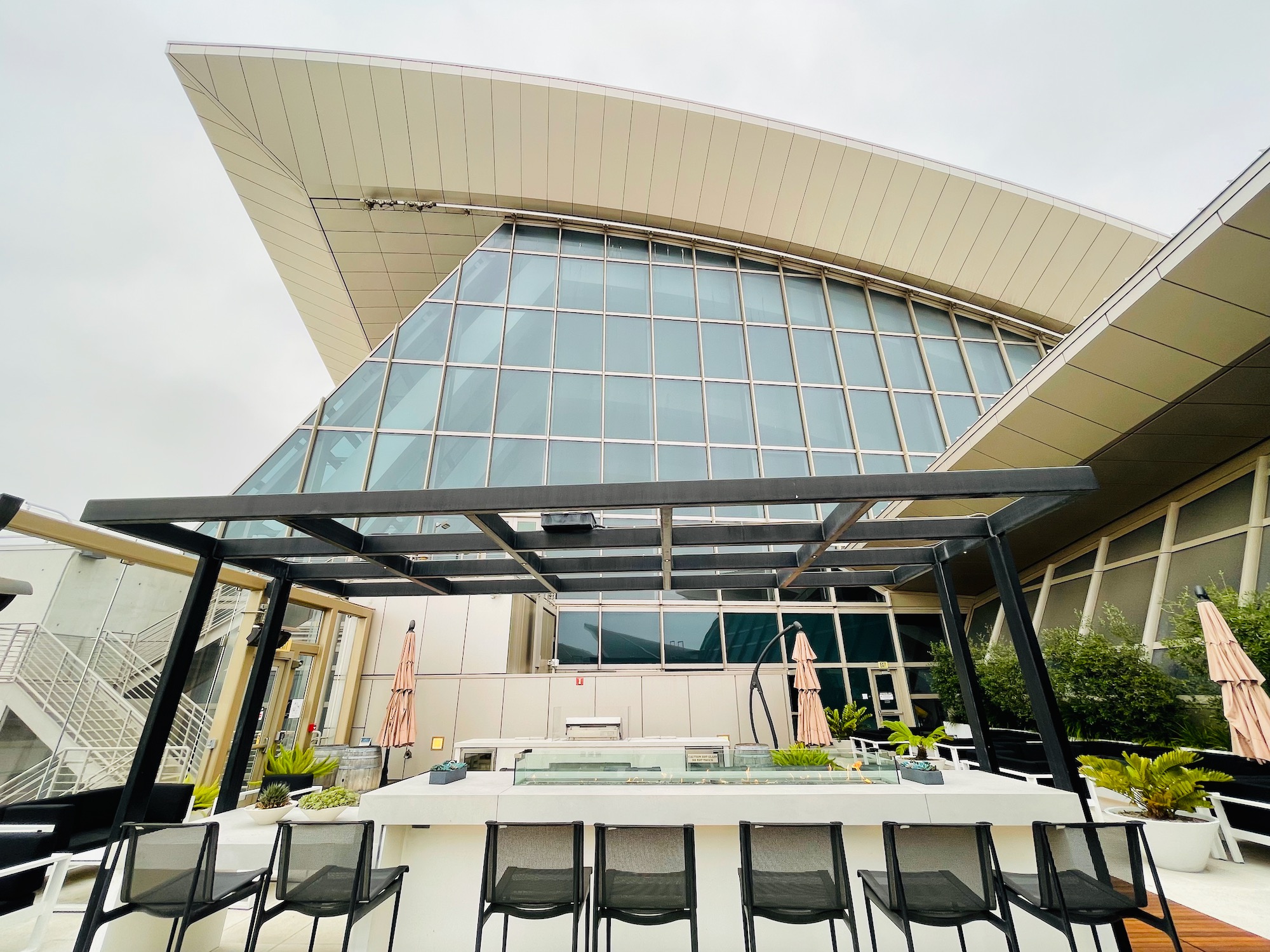 a building with a roof and chairs