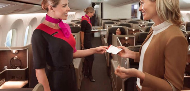 a woman handing a ticket to another woman