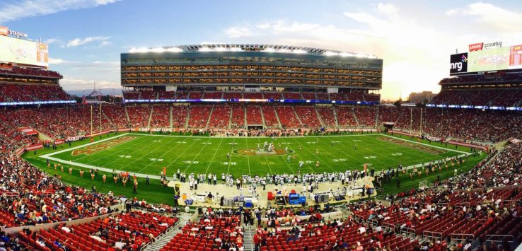 a football stadium with people on the field