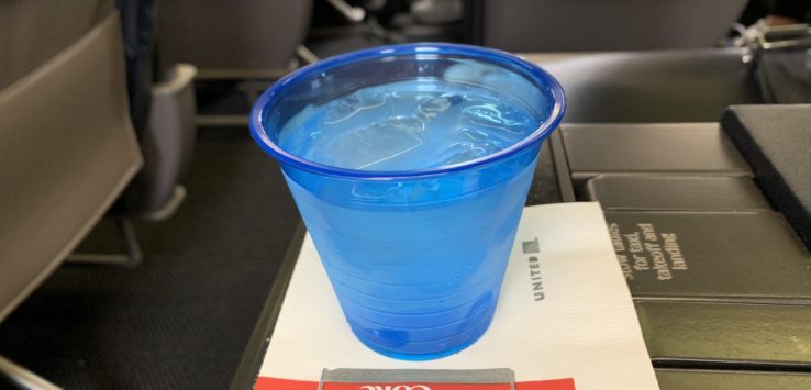 a blue plastic cup on a napkin