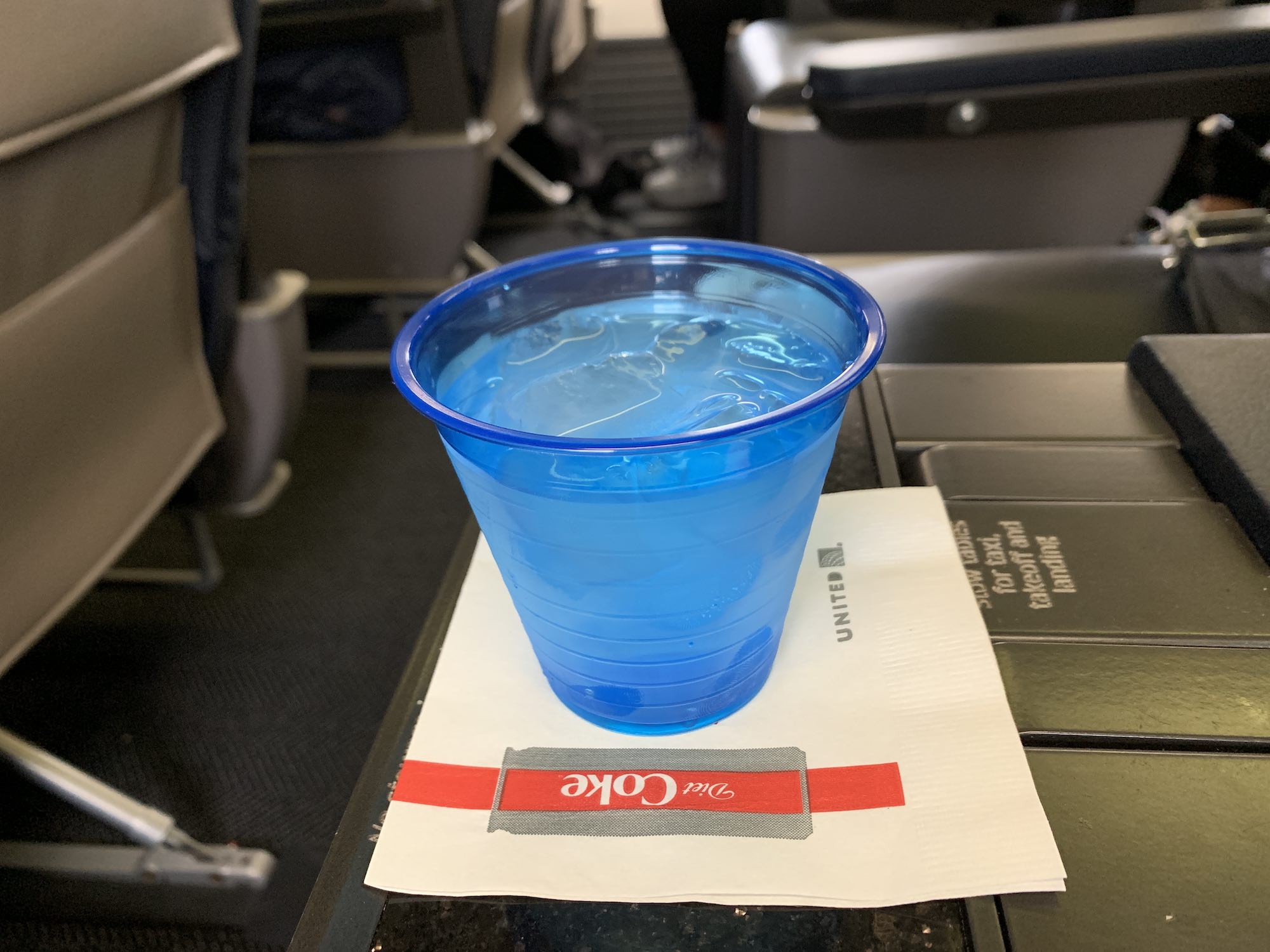 a blue plastic cup on a napkin