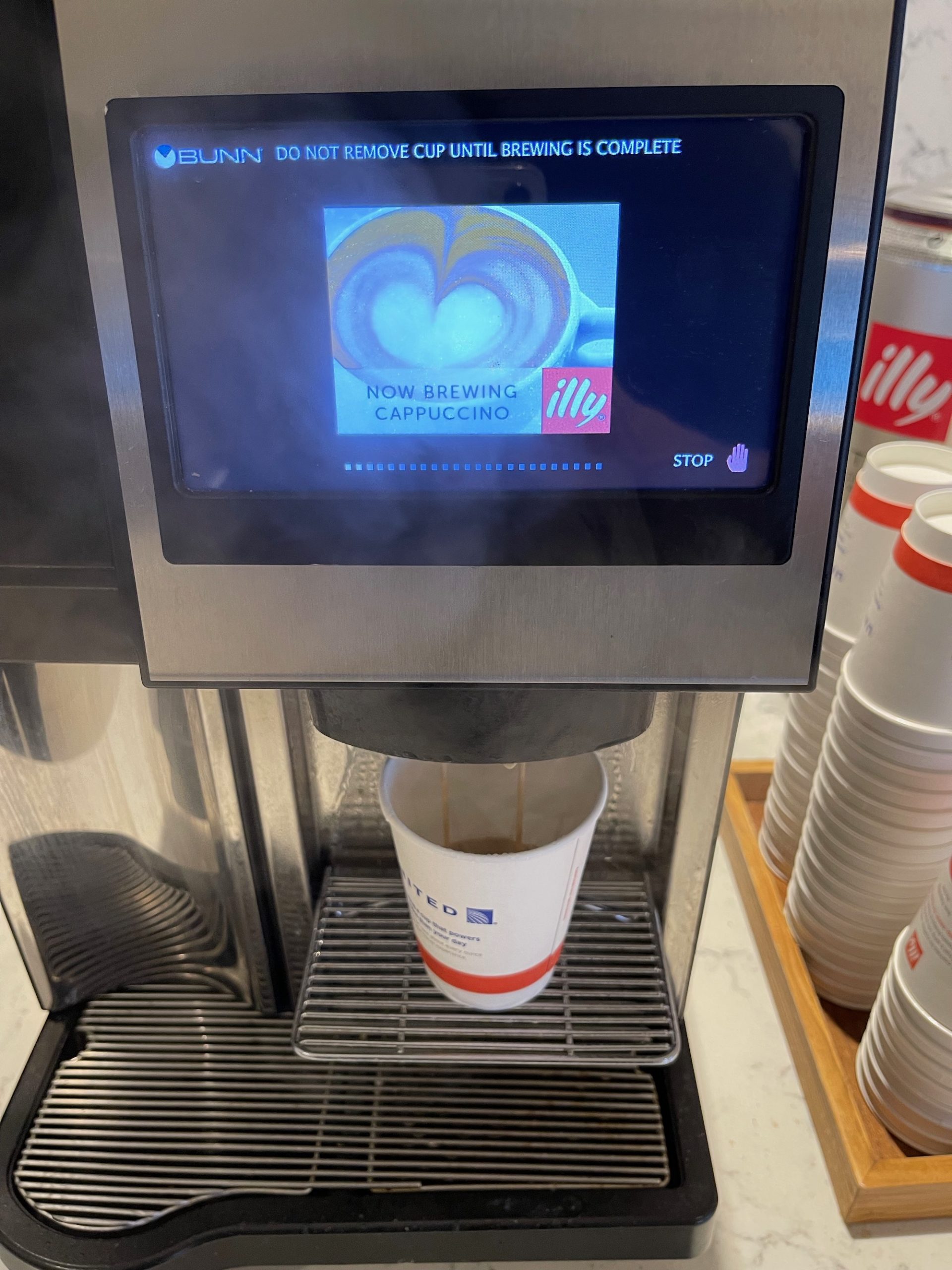 a coffee machine with a screen and a screen on it