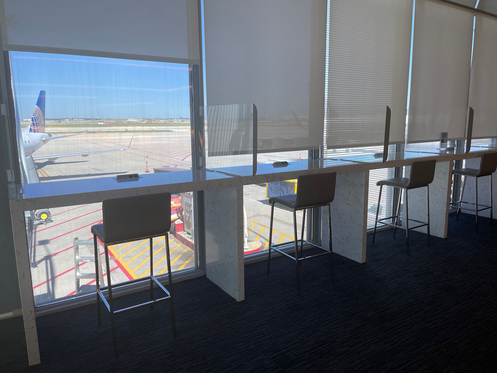 a desks and chairs in a room with a window