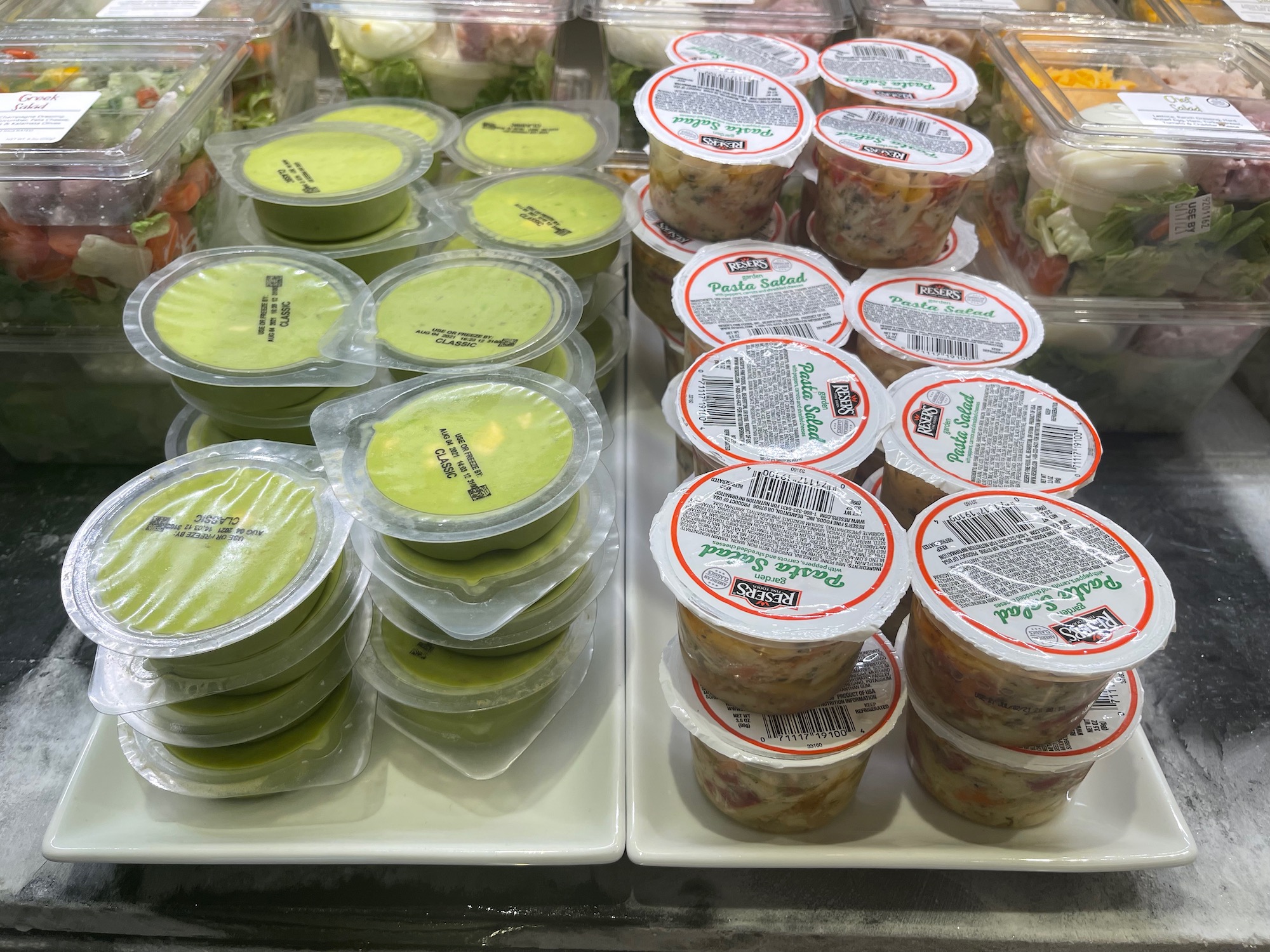 a group of plastic containers of food