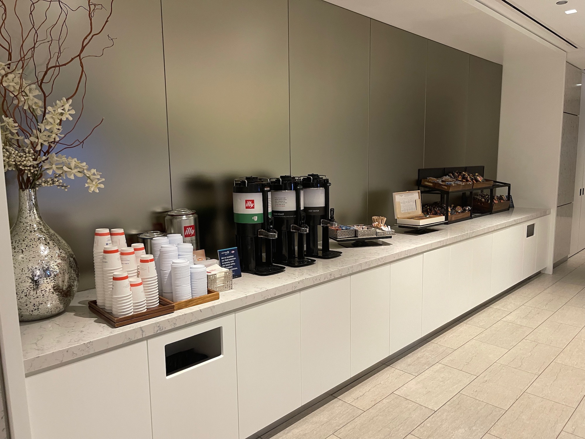 a buffet with coffee cups and coffee machines
