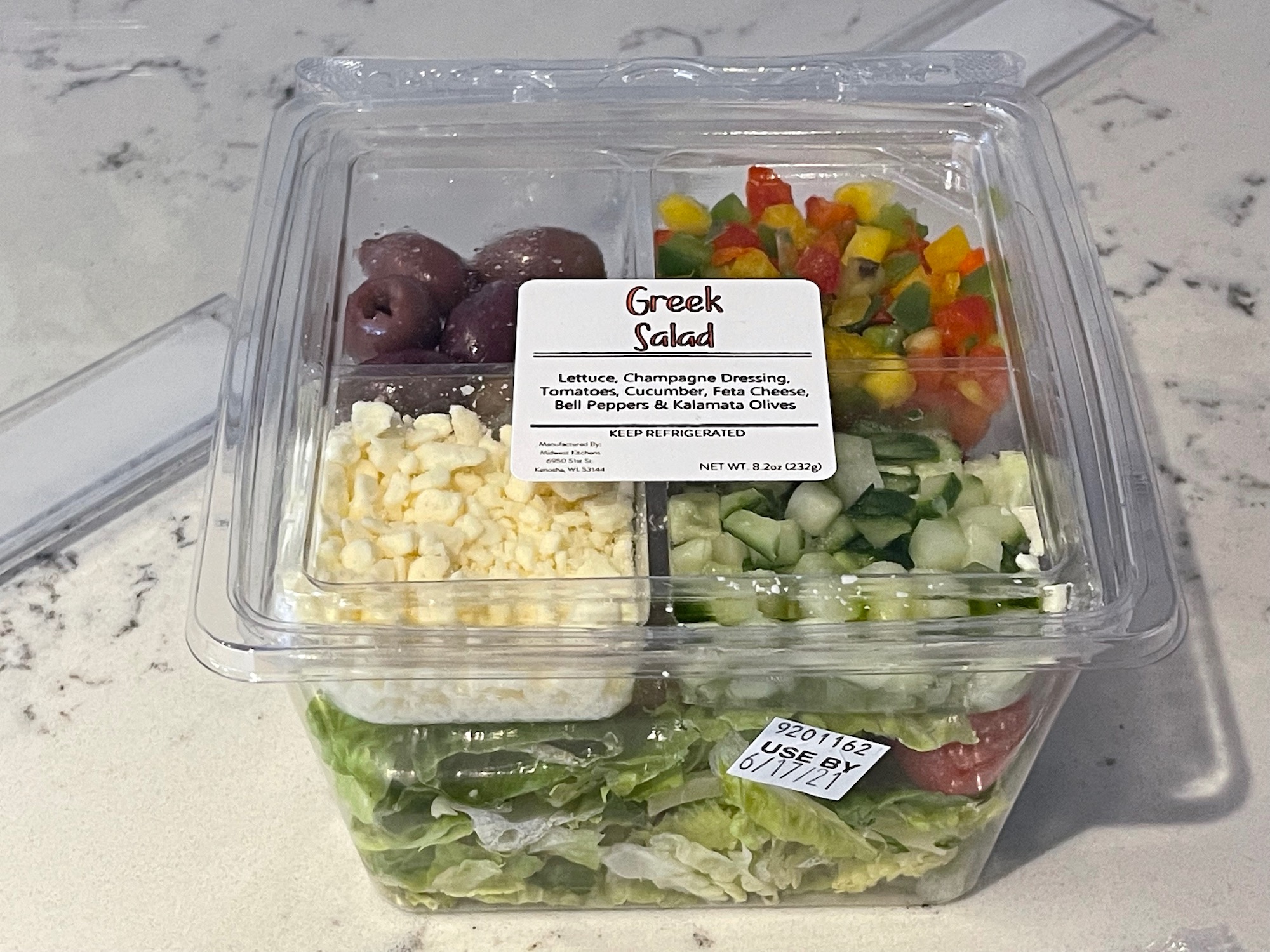 a salad in a plastic container