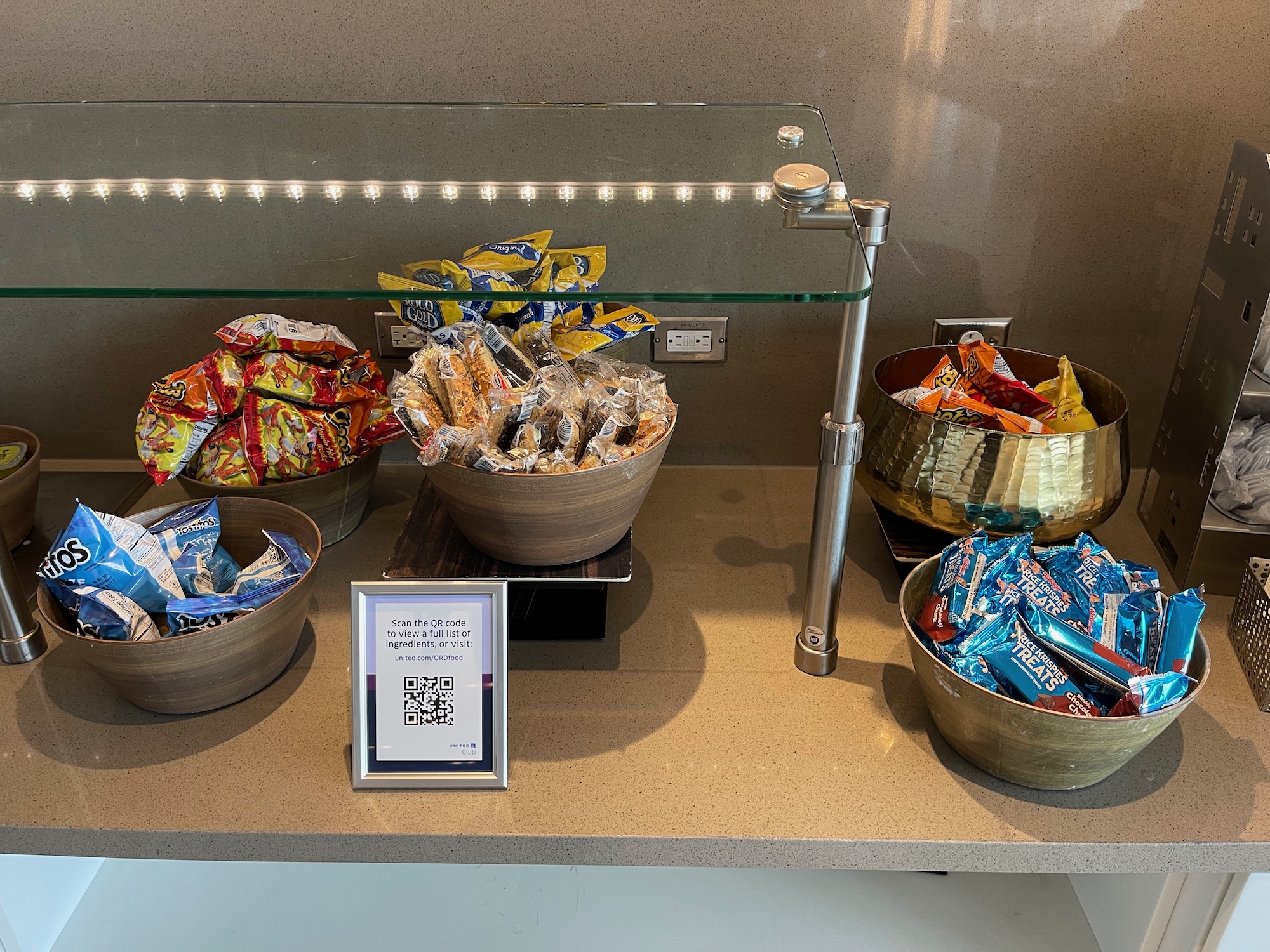 a group of bowls of food on a counter