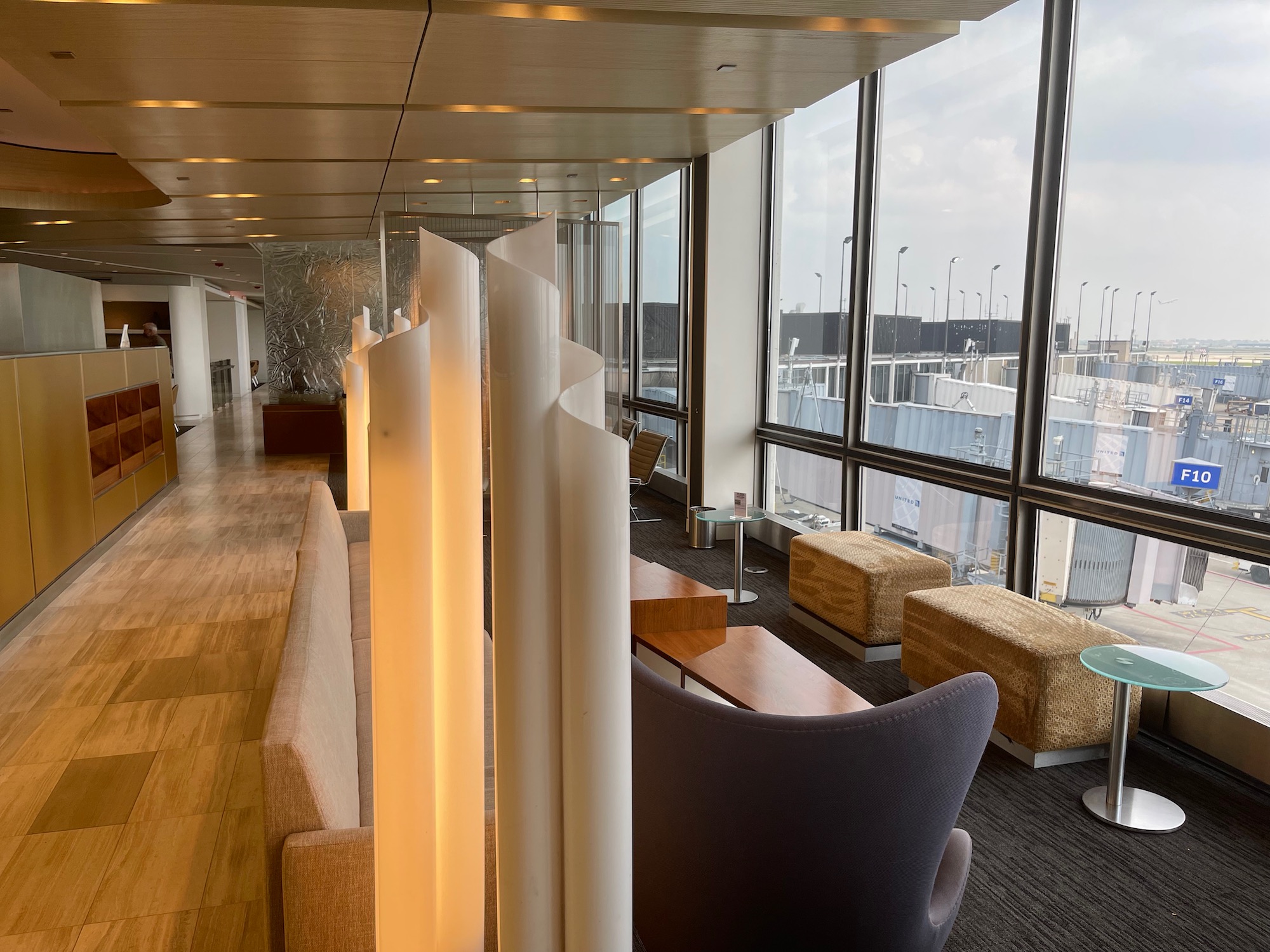 a room with a large window and a large white lamp