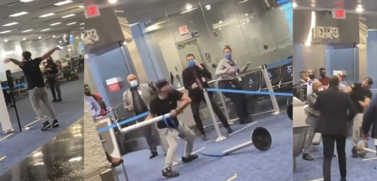 a group of people in a room with a blue tape around them