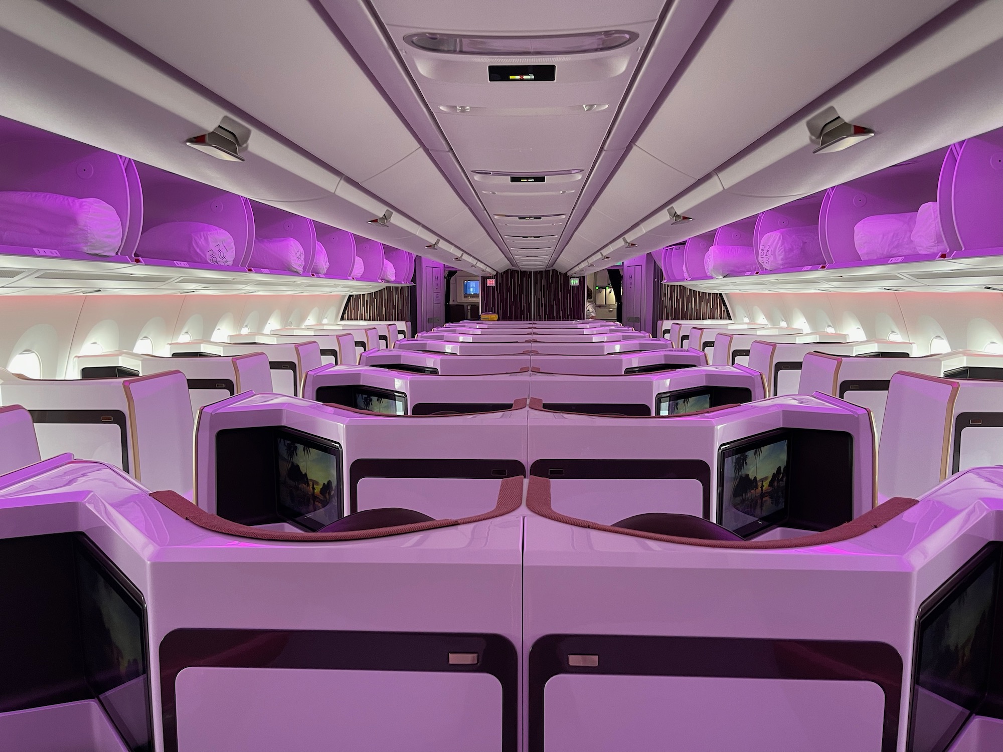 a inside of a plane with purple lights