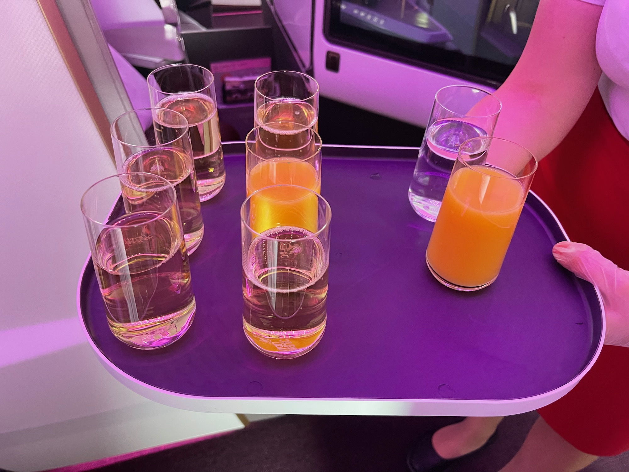 a tray of glasses with liquid on it