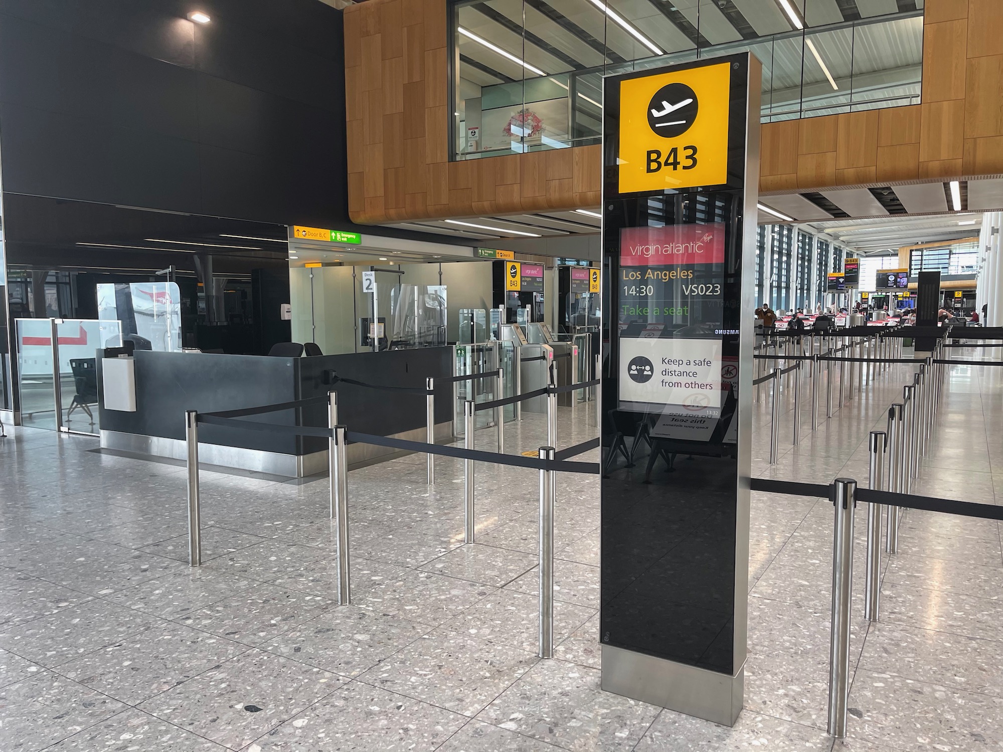 a black and yellow sign in a airport