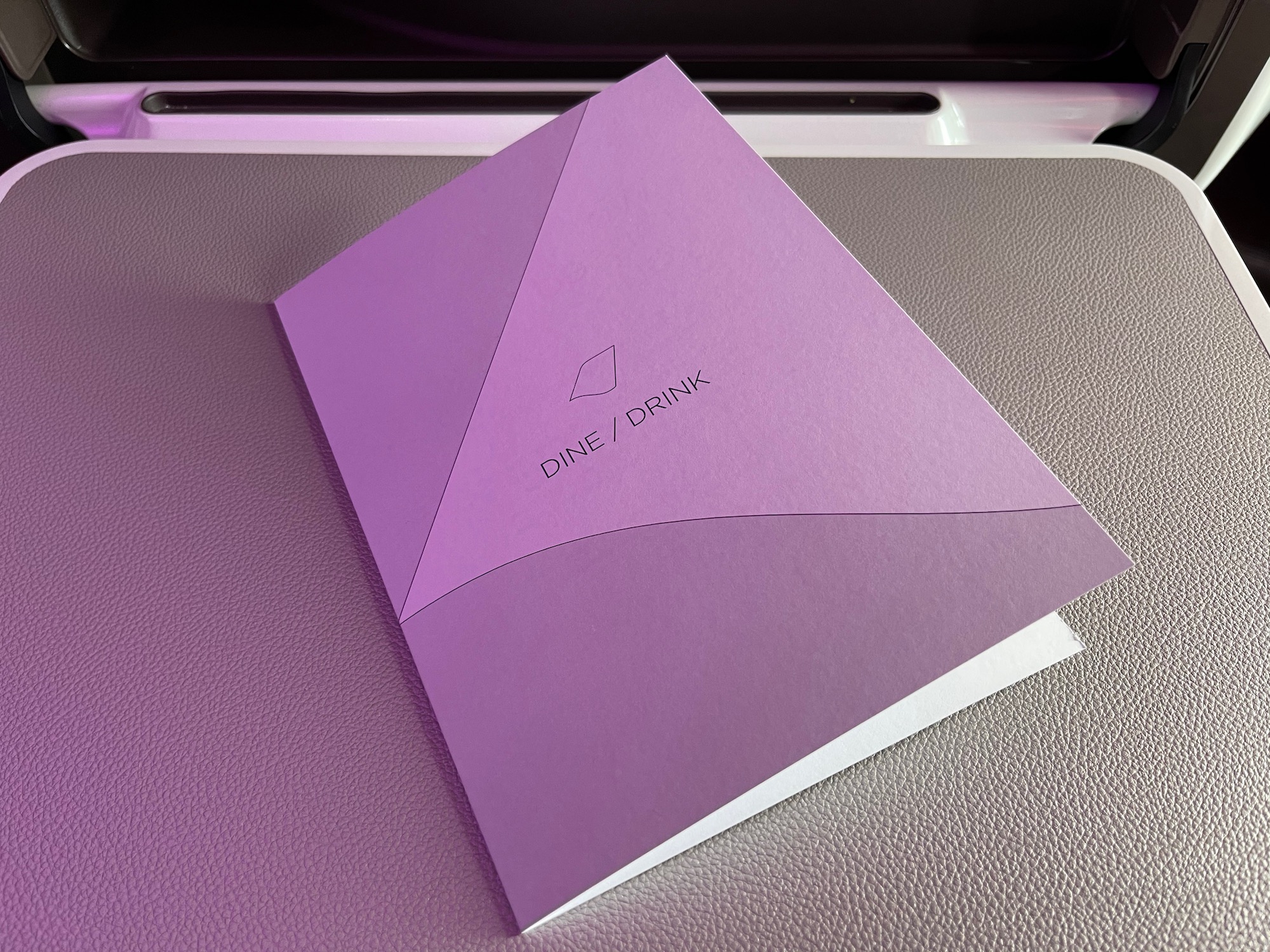 a purple square object on a white surface