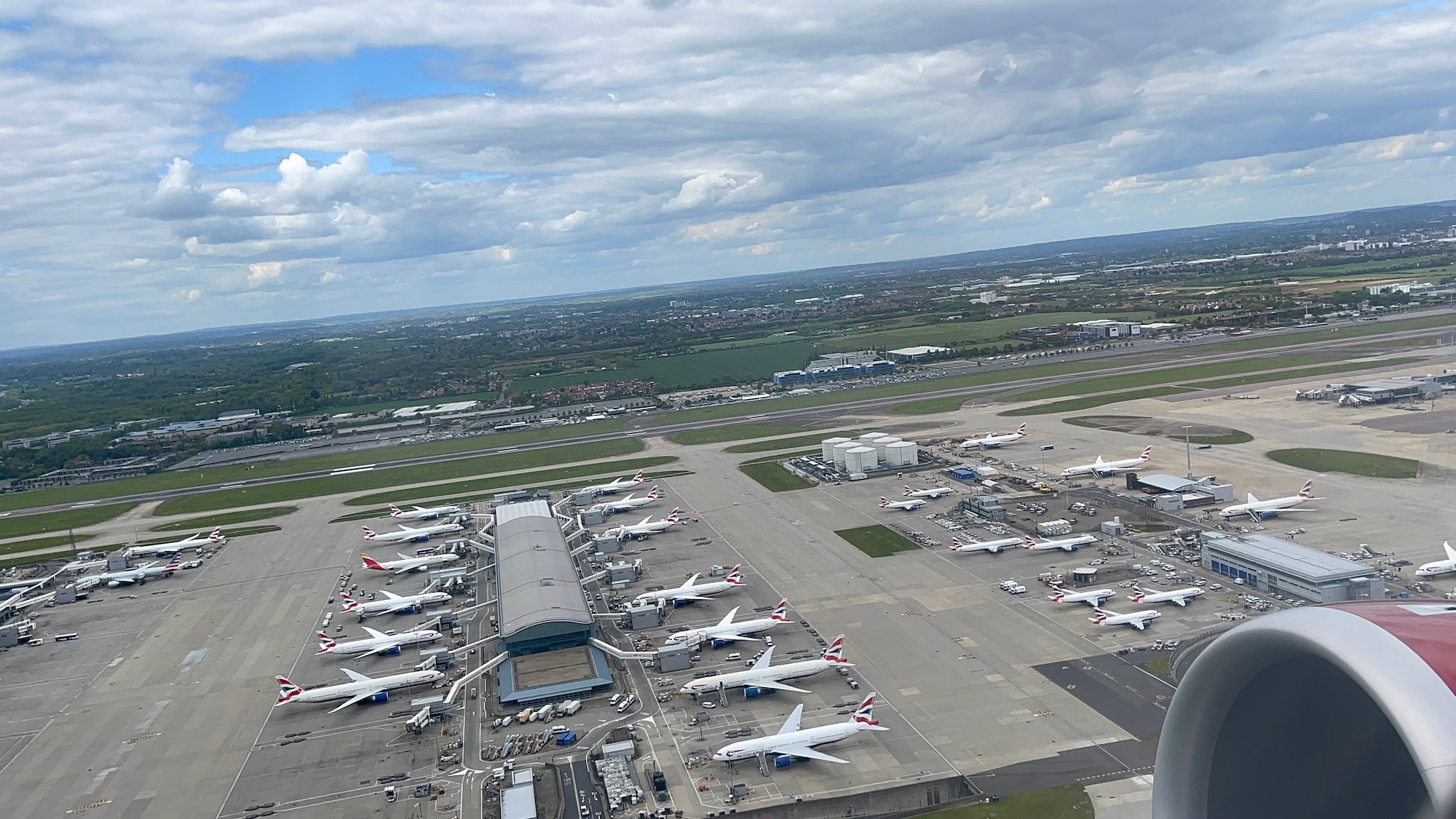 an aerial view of an airport with airplanes parked on the ground