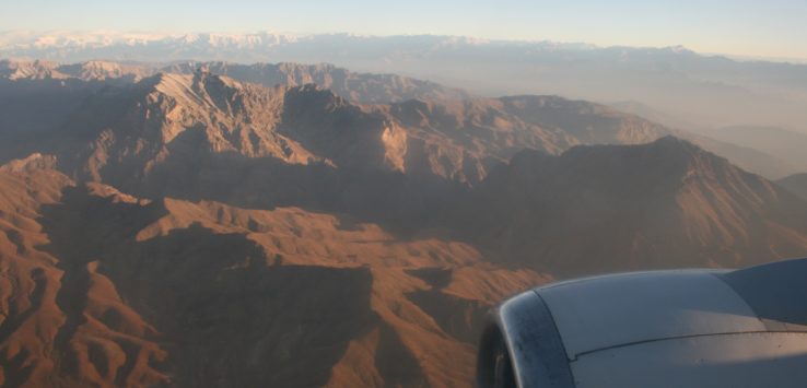 a view of mountains from an airplane