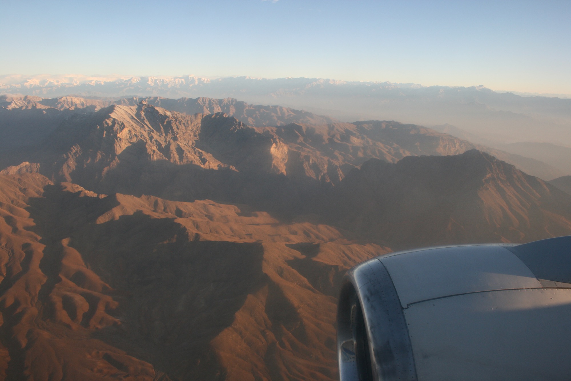 a view of mountains from an airplane