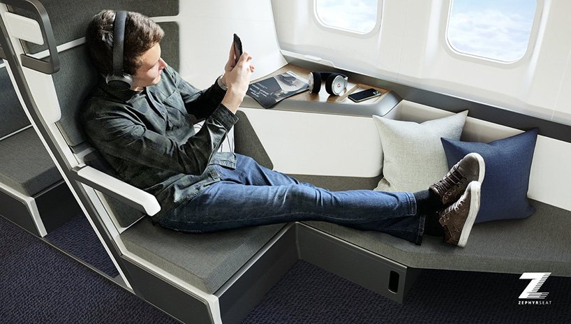 a man sitting on a chair with his feet up