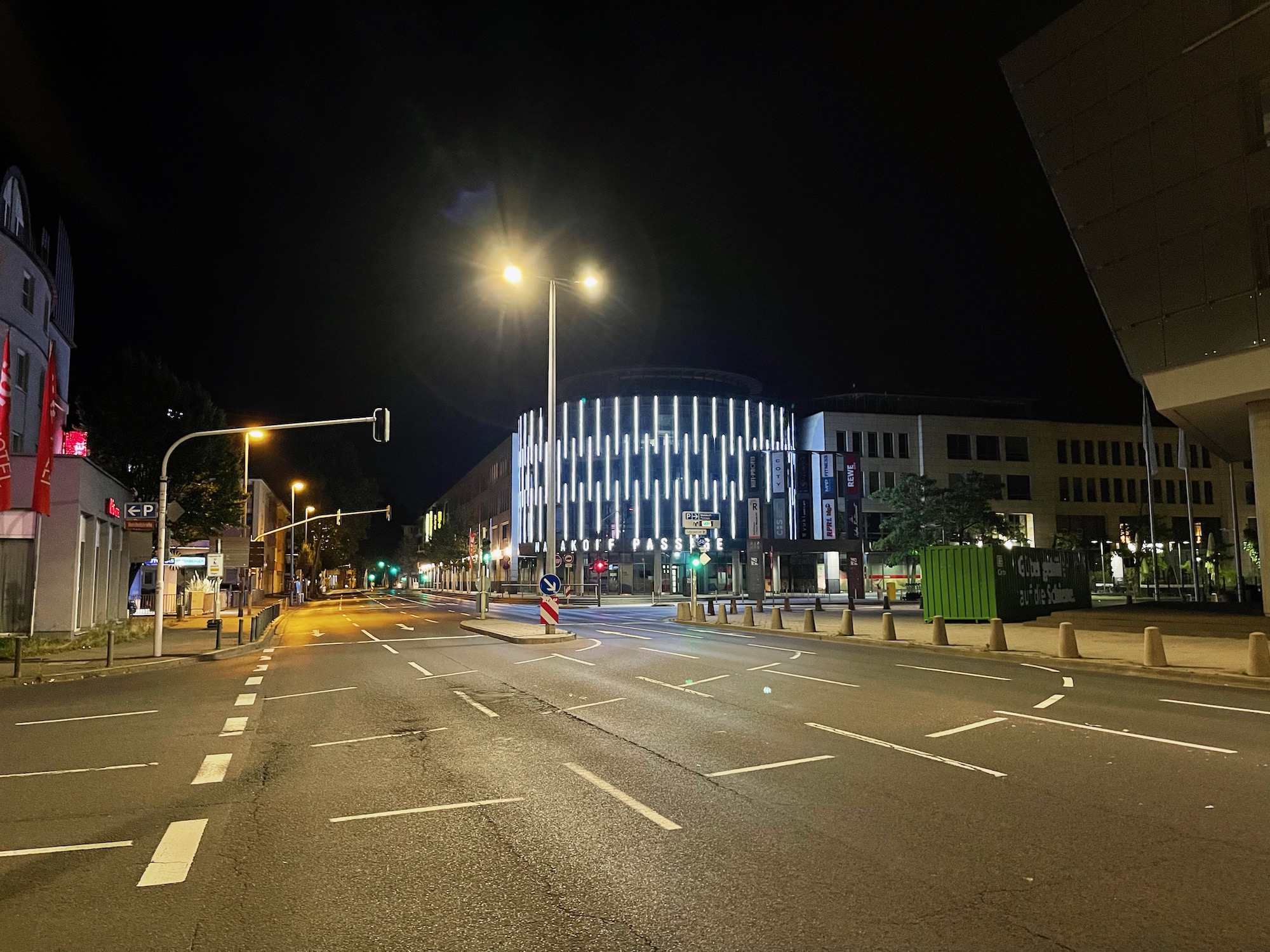 a street with lights on the side of a road