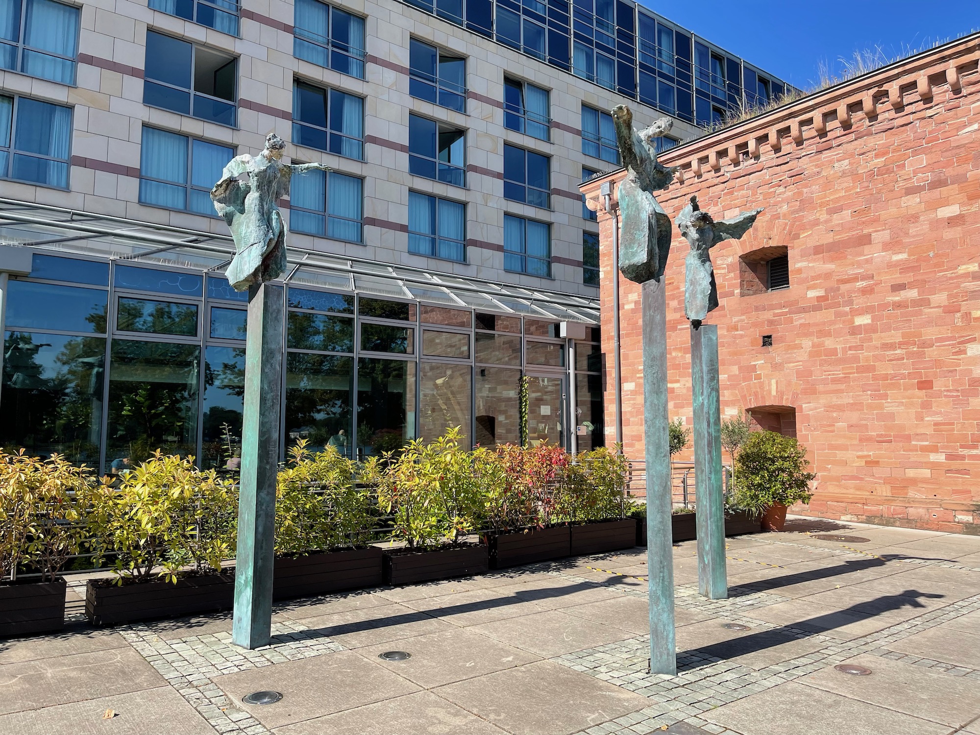 a group of statues outside of a building