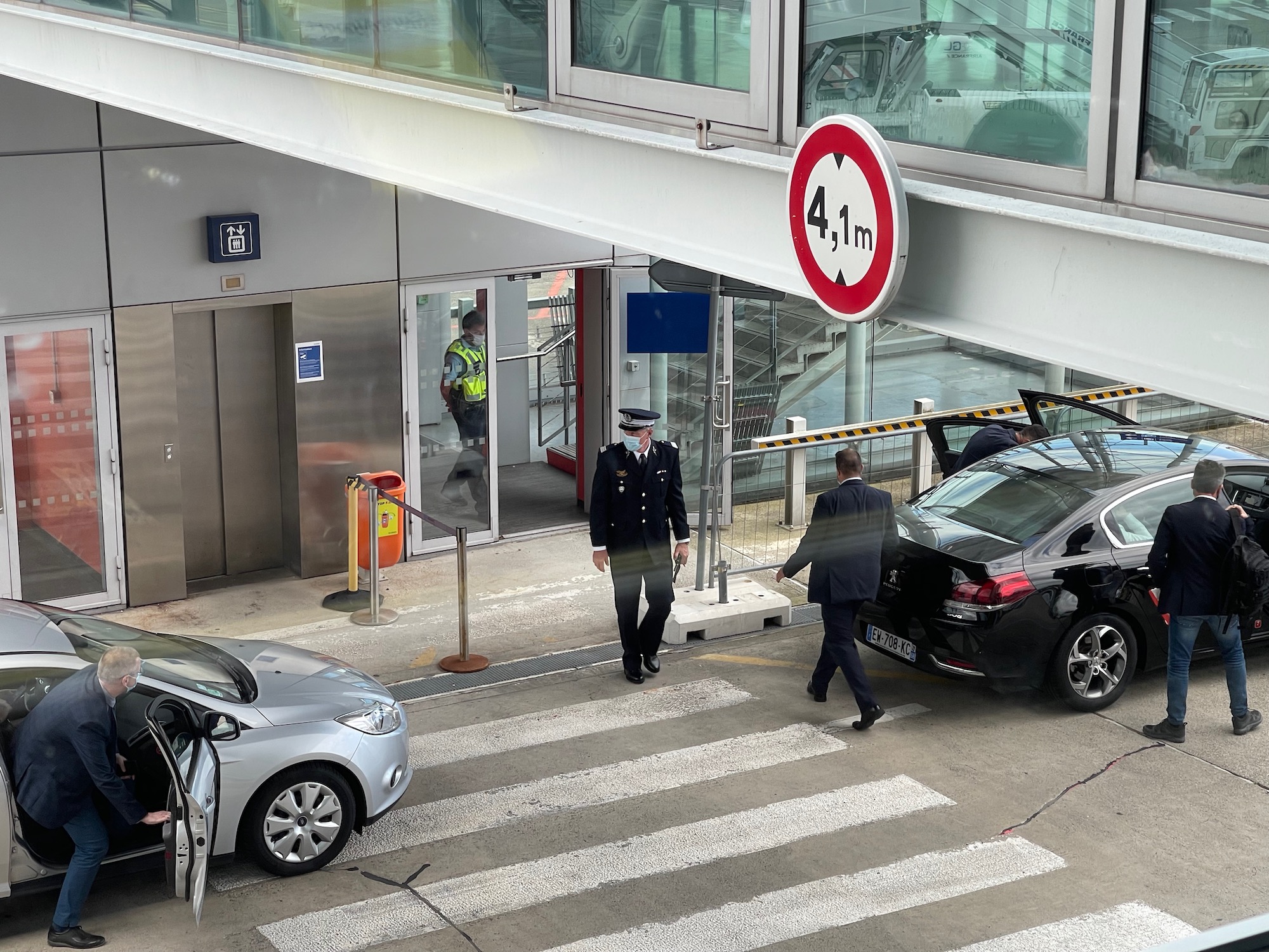 a police officer standing next to a car