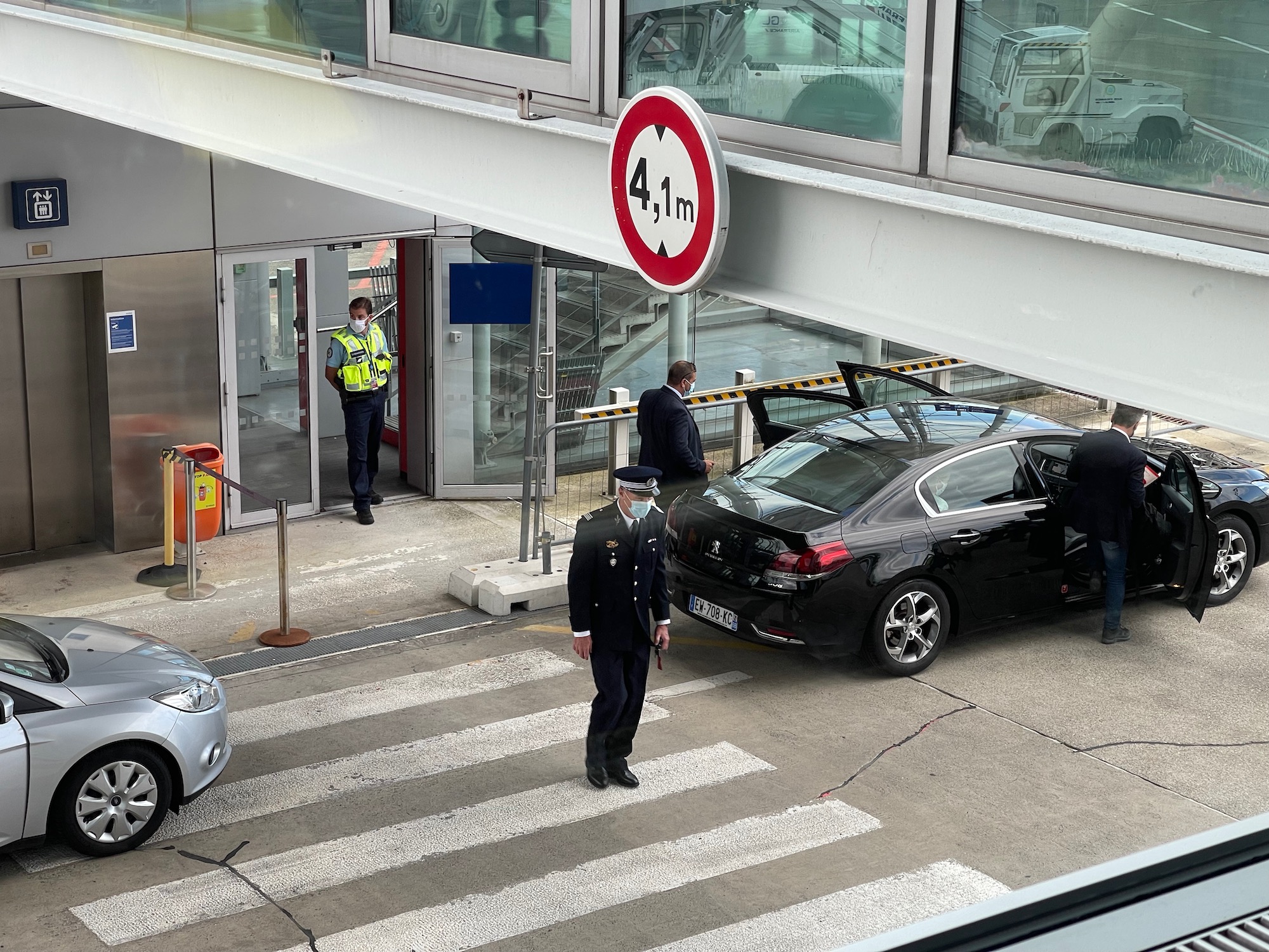 a police officer standing in front of a car