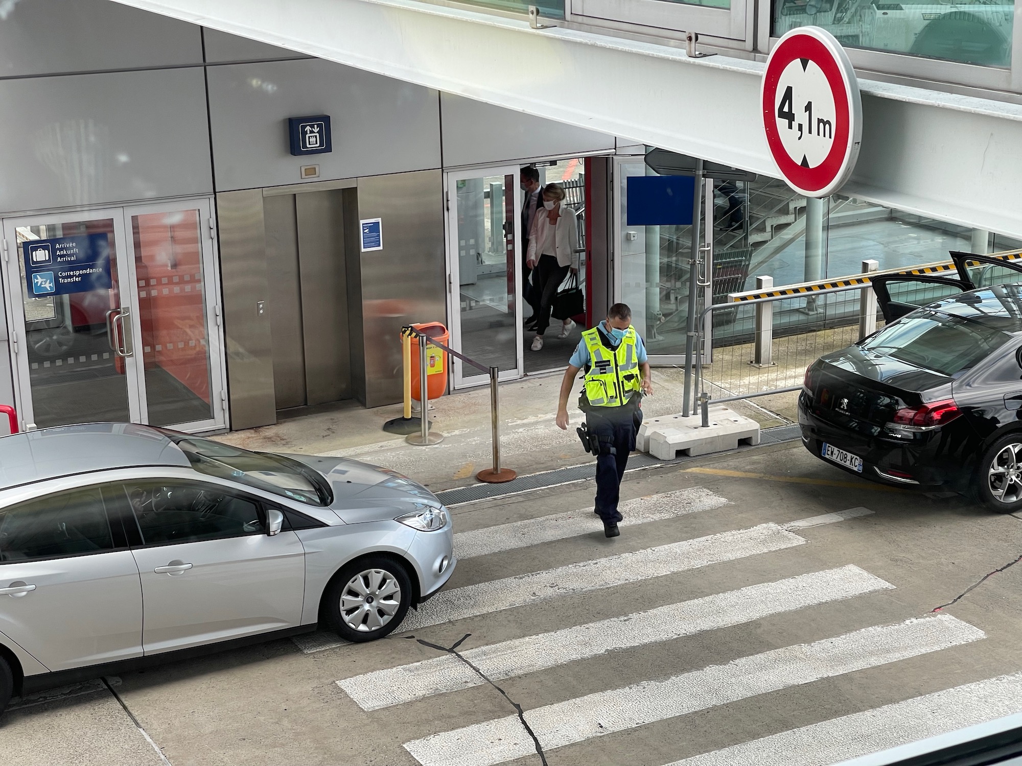 a man walking on a crosswalk