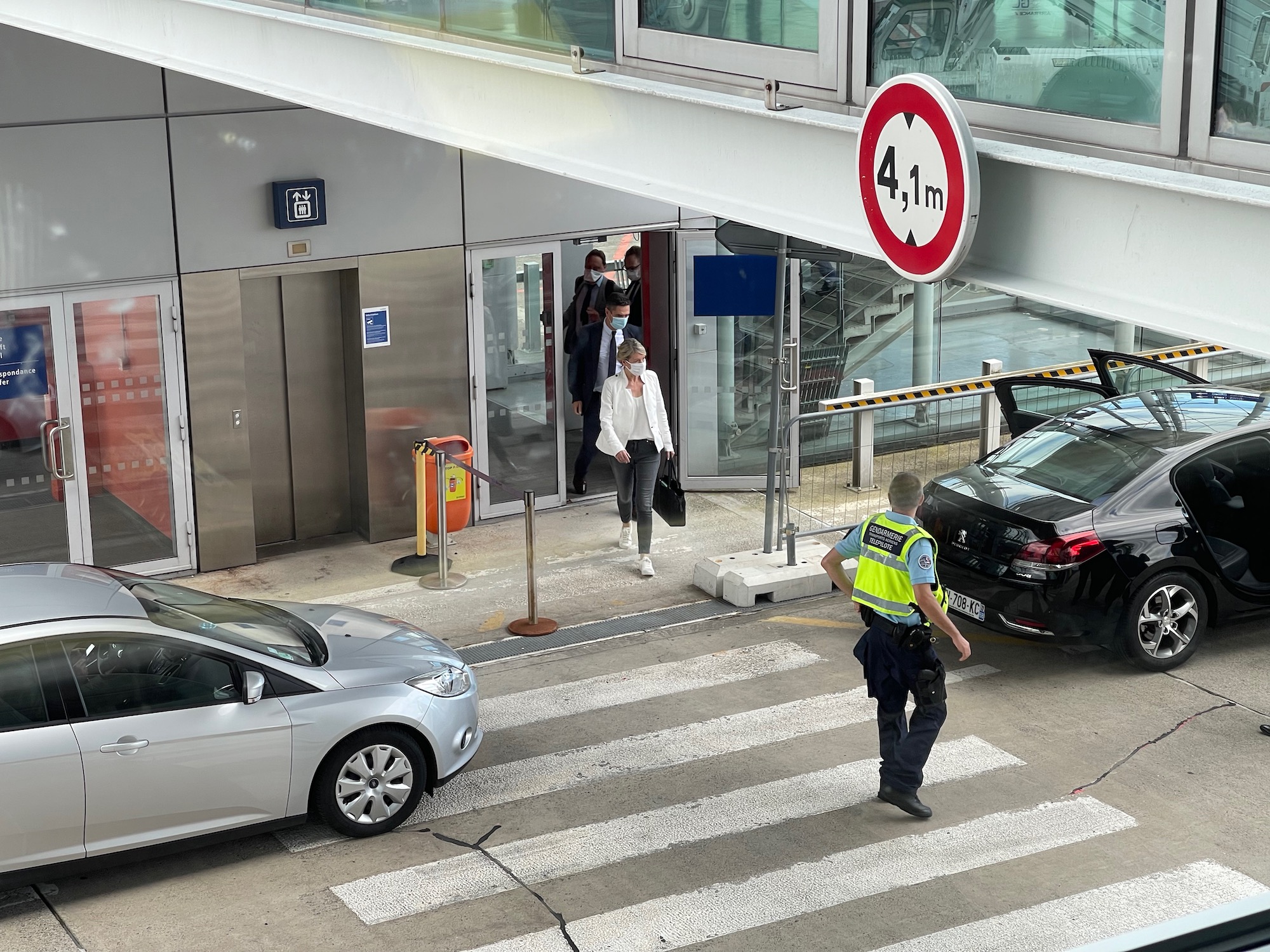 a police officer standing at a crosswalk