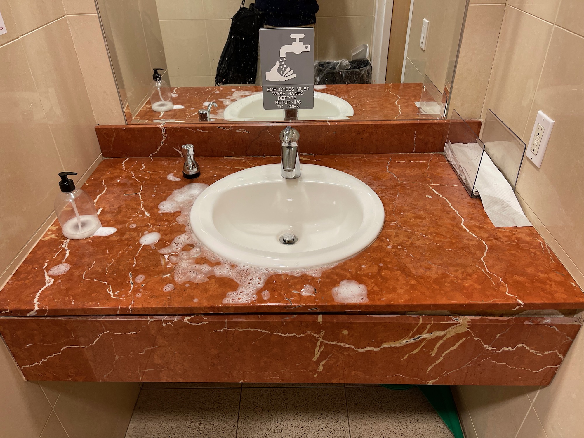 a sink and mirror in a bathroom
