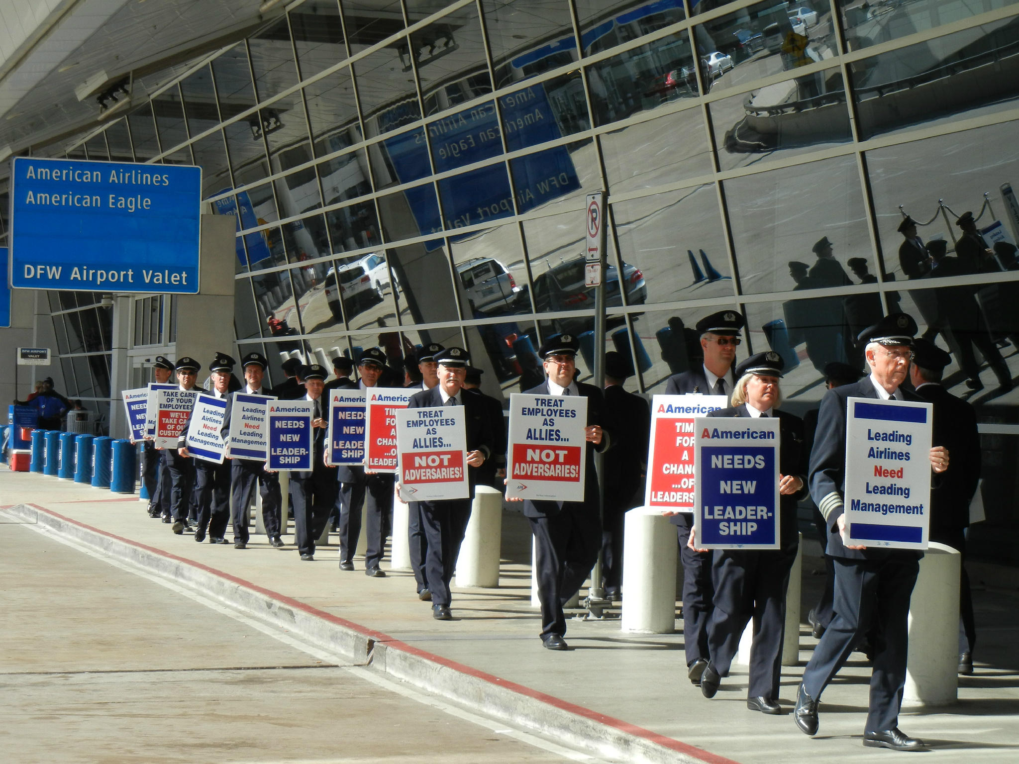 a group of people holding signs