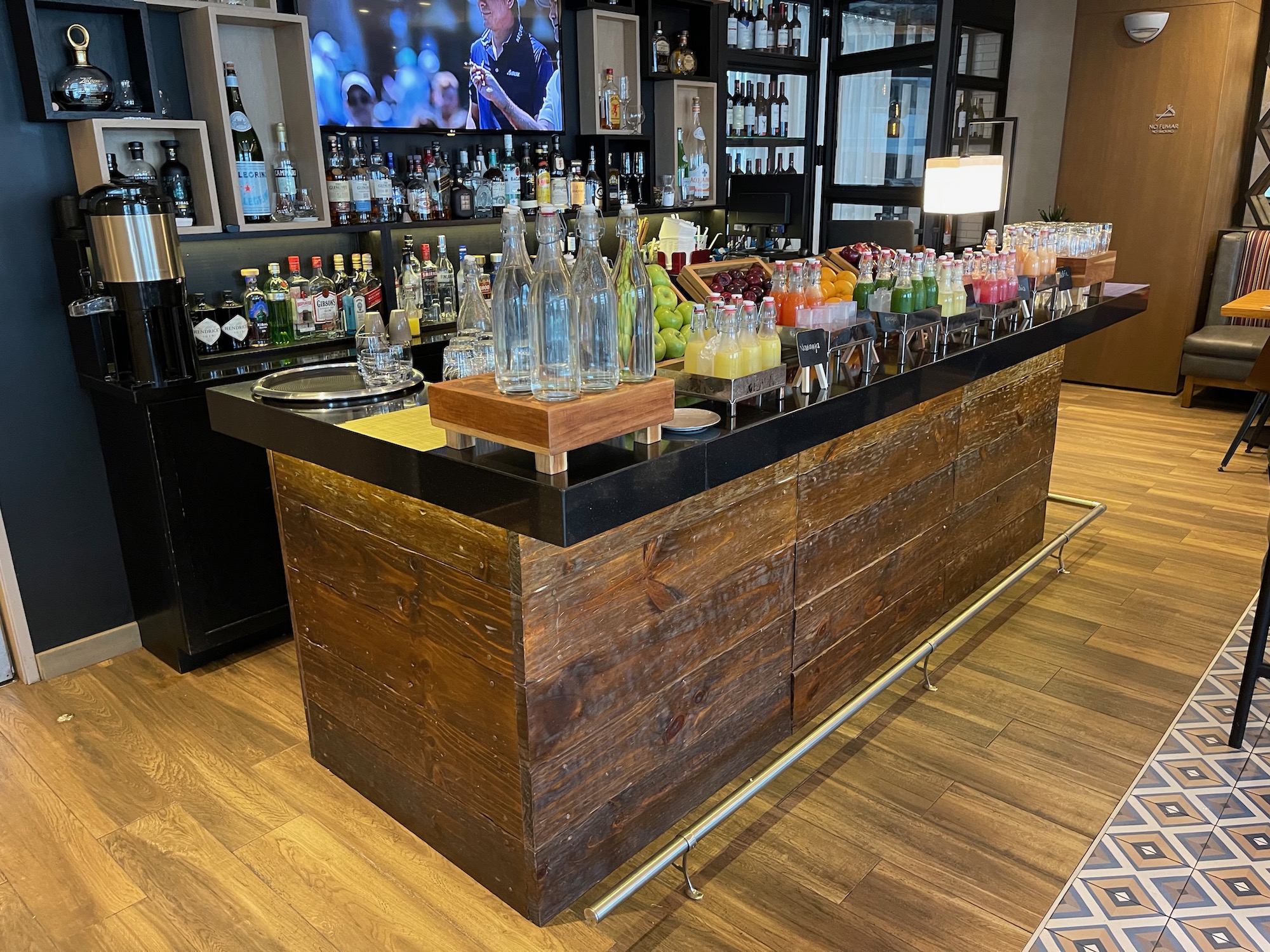 a bar with bottles of liquid and bottles of juice