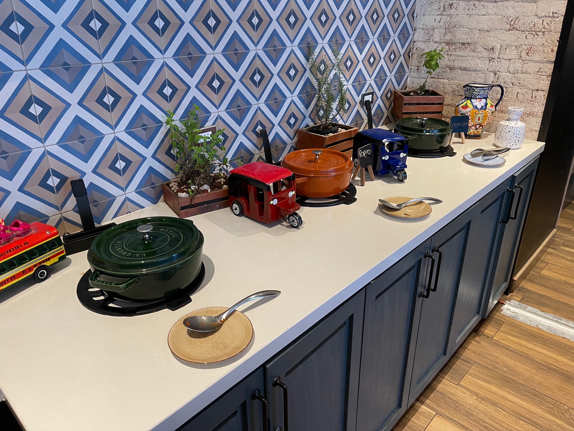 a kitchen counter with pots and utensils