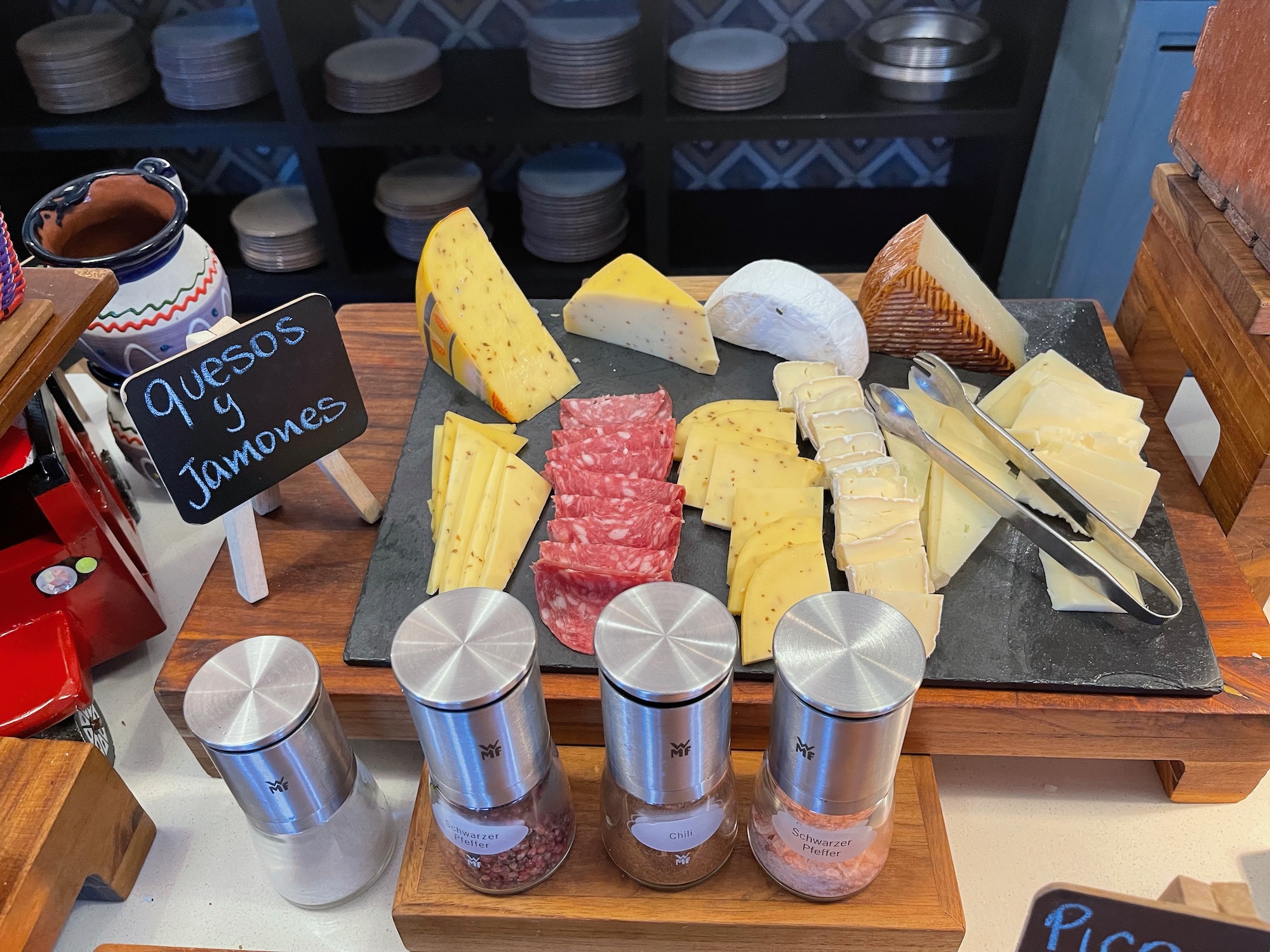 a cheese platter with different types of cheese and meat