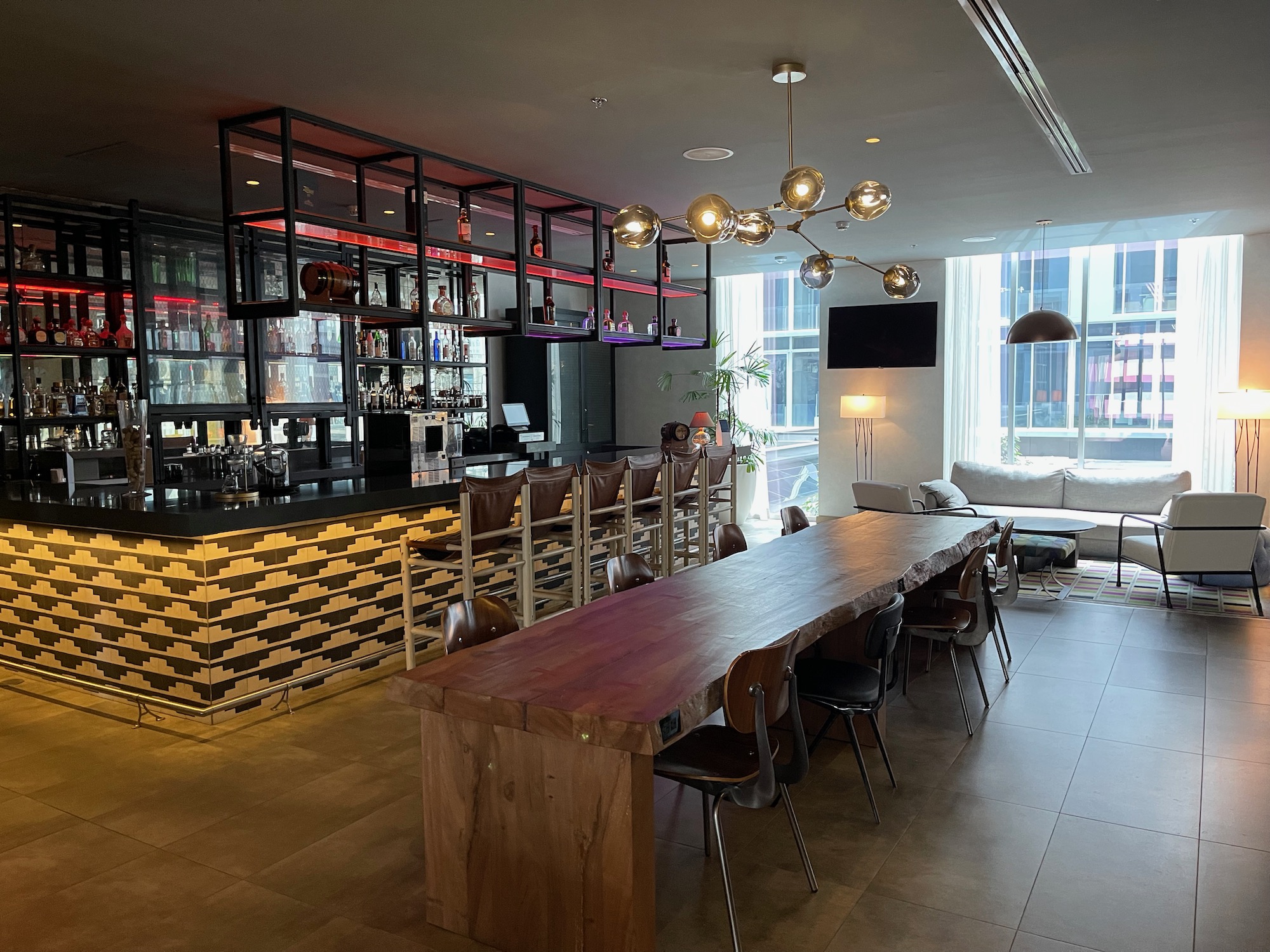 a room with a long table and chairs