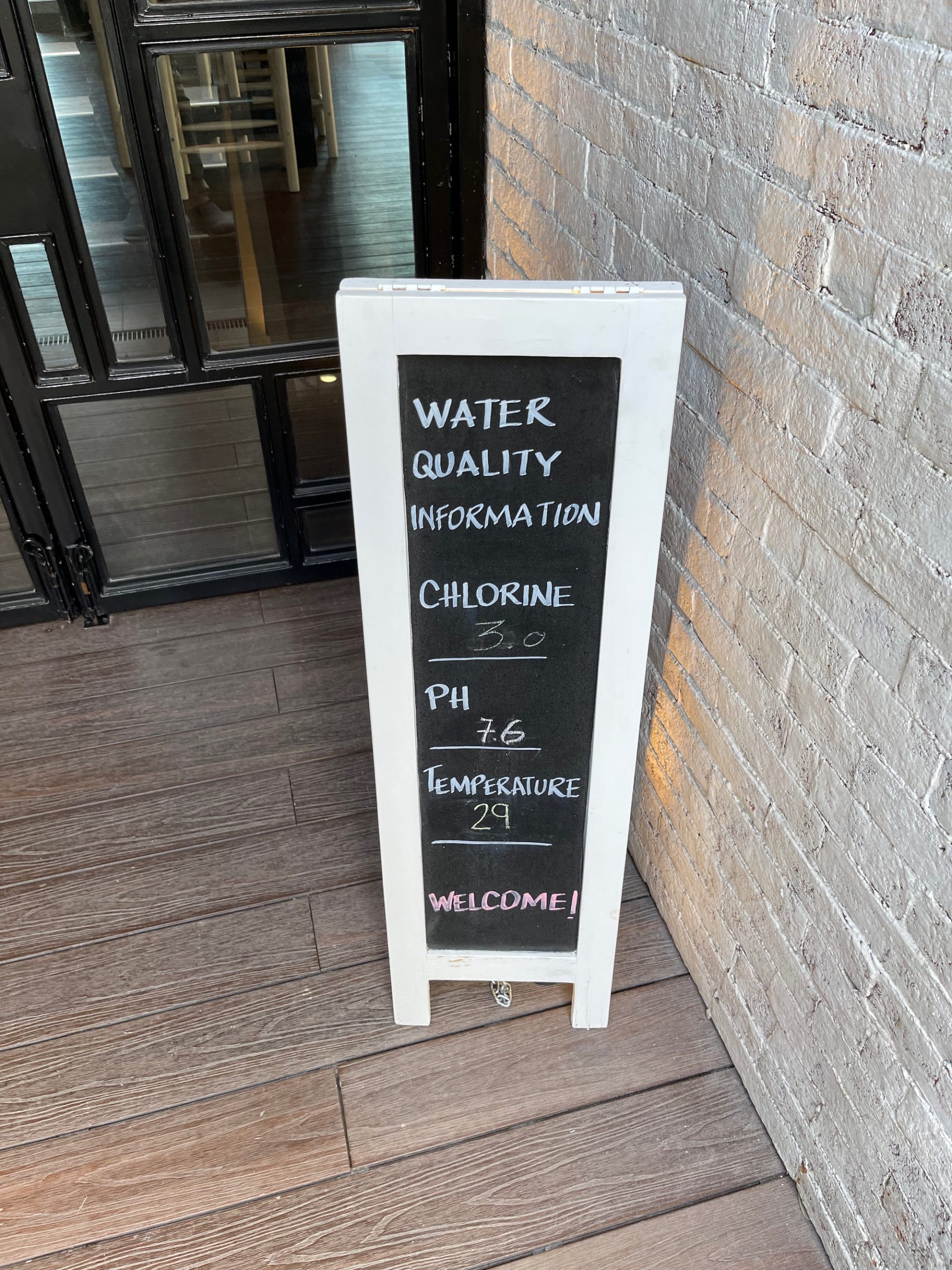 a chalkboard sign with writing on it