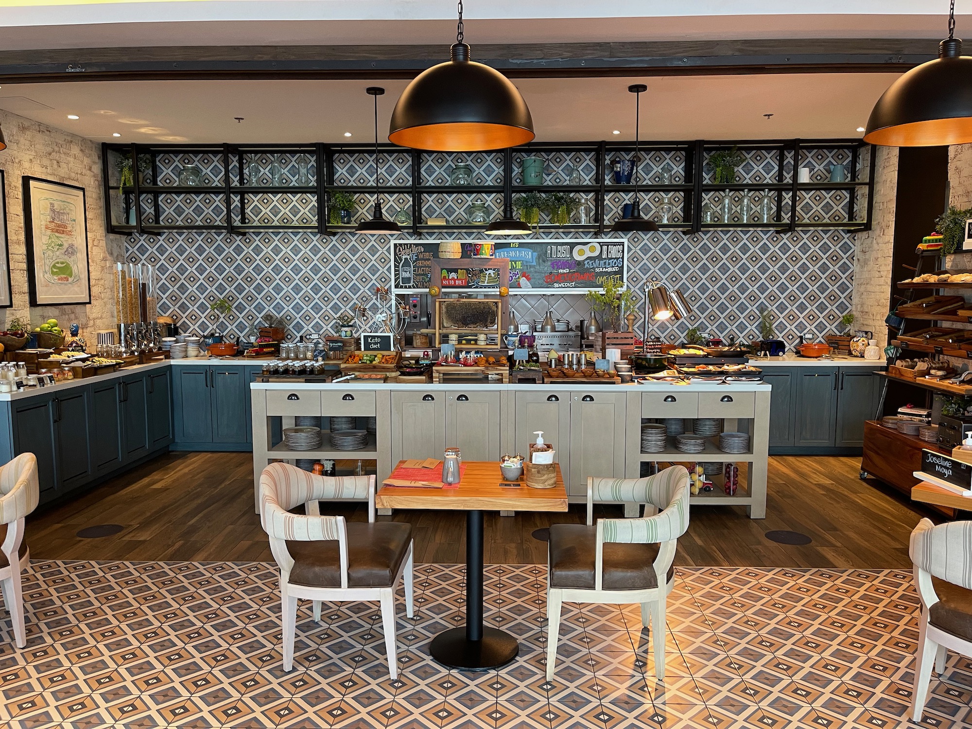 a kitchen with a table and chairs