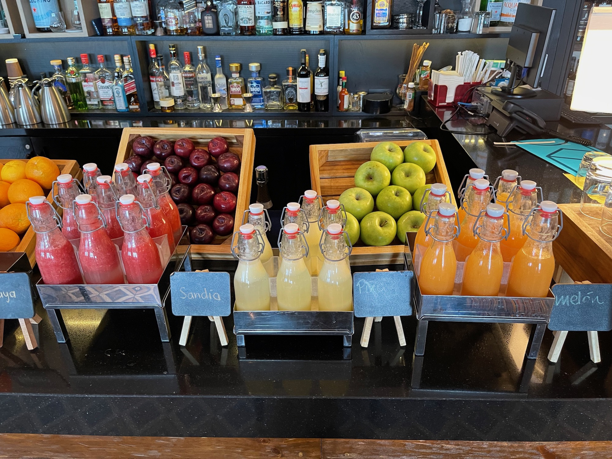 a variety of fruit and juices on a counter