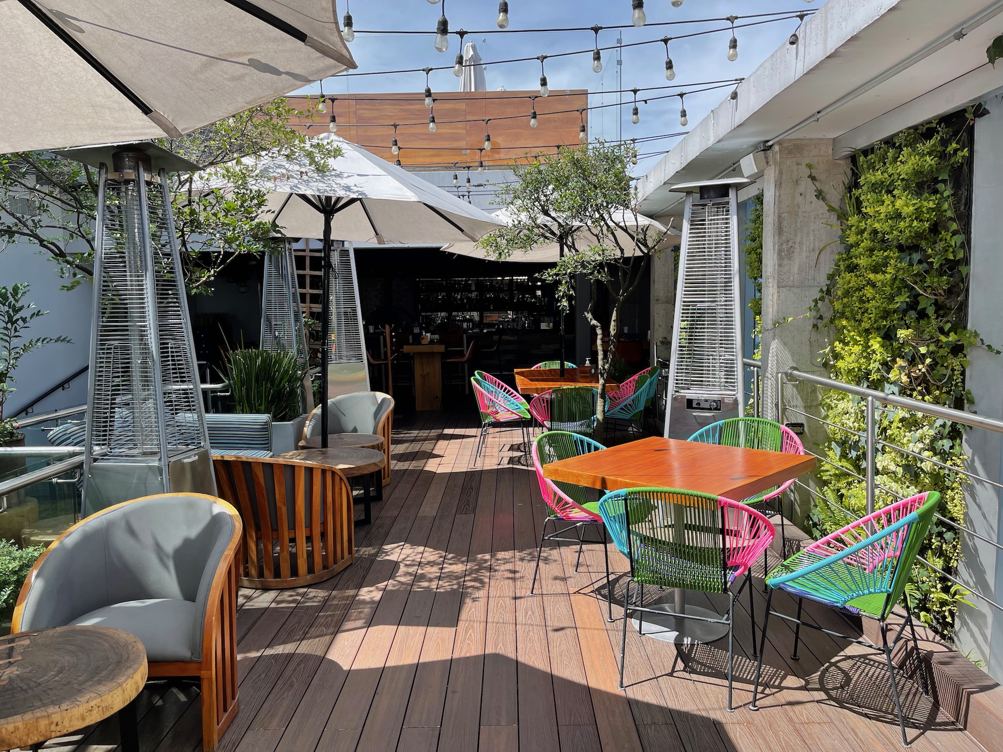 a patio with chairs and tables