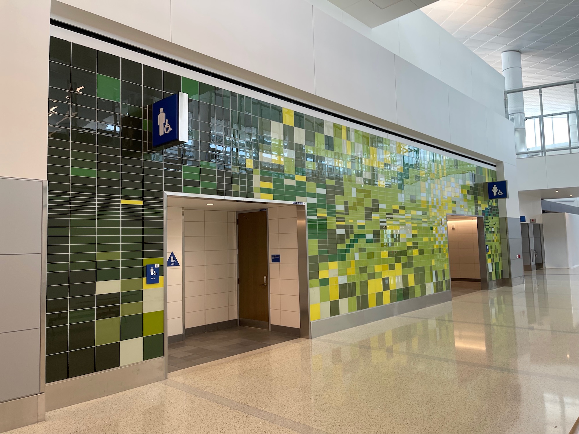 a hallway with a tiled wall