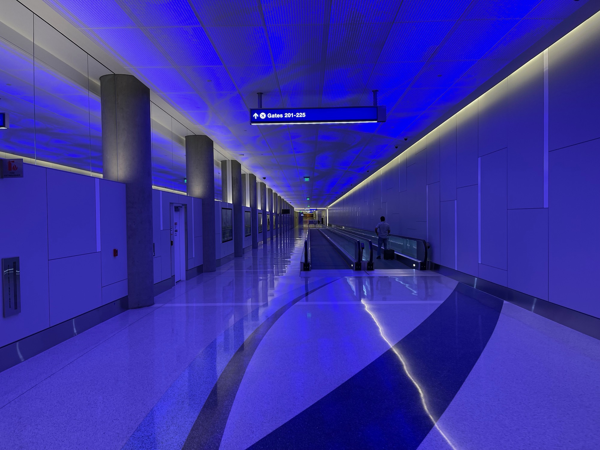 a long hallway with a blue light