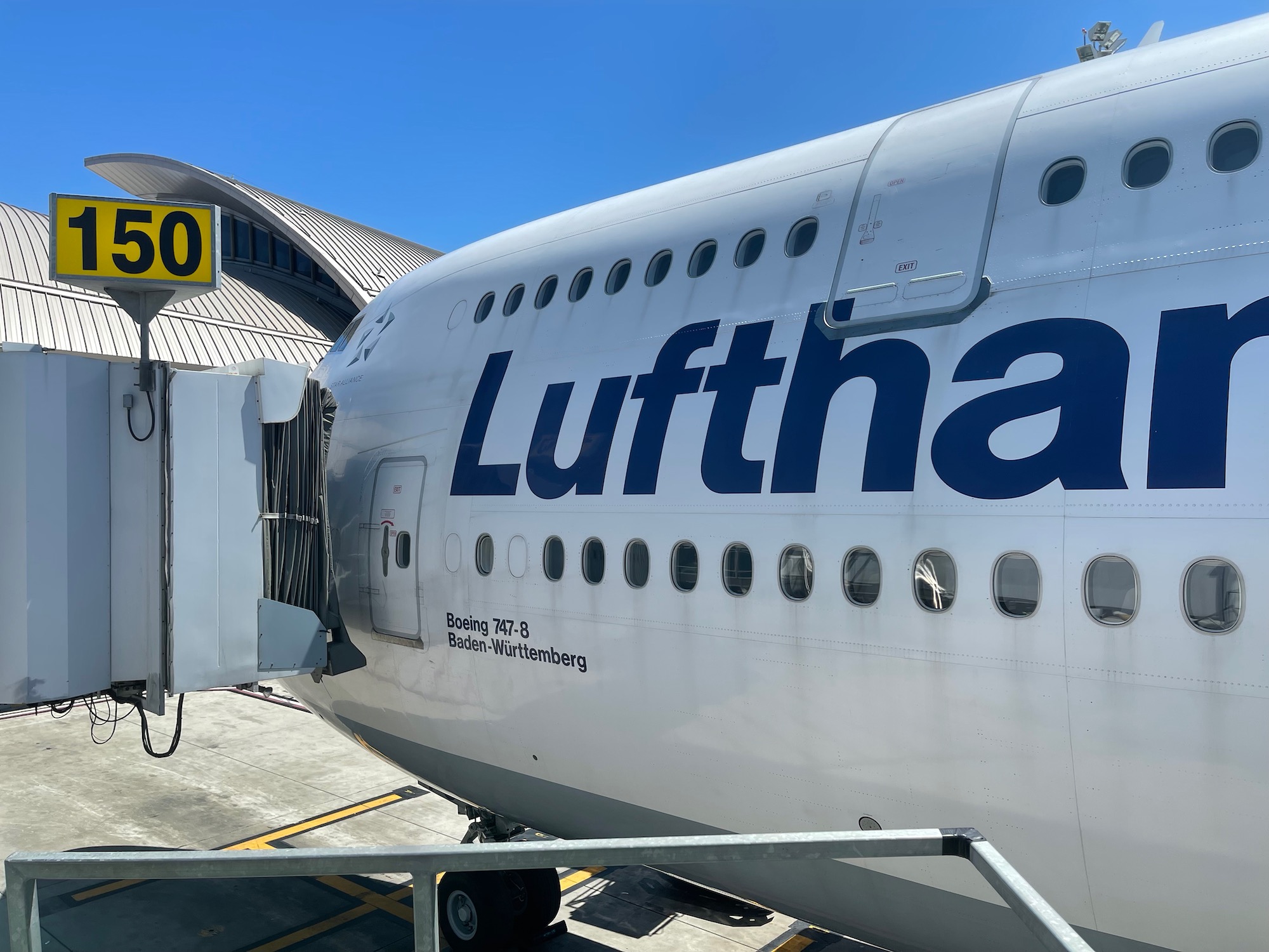 a large white airplane with blue writing on it