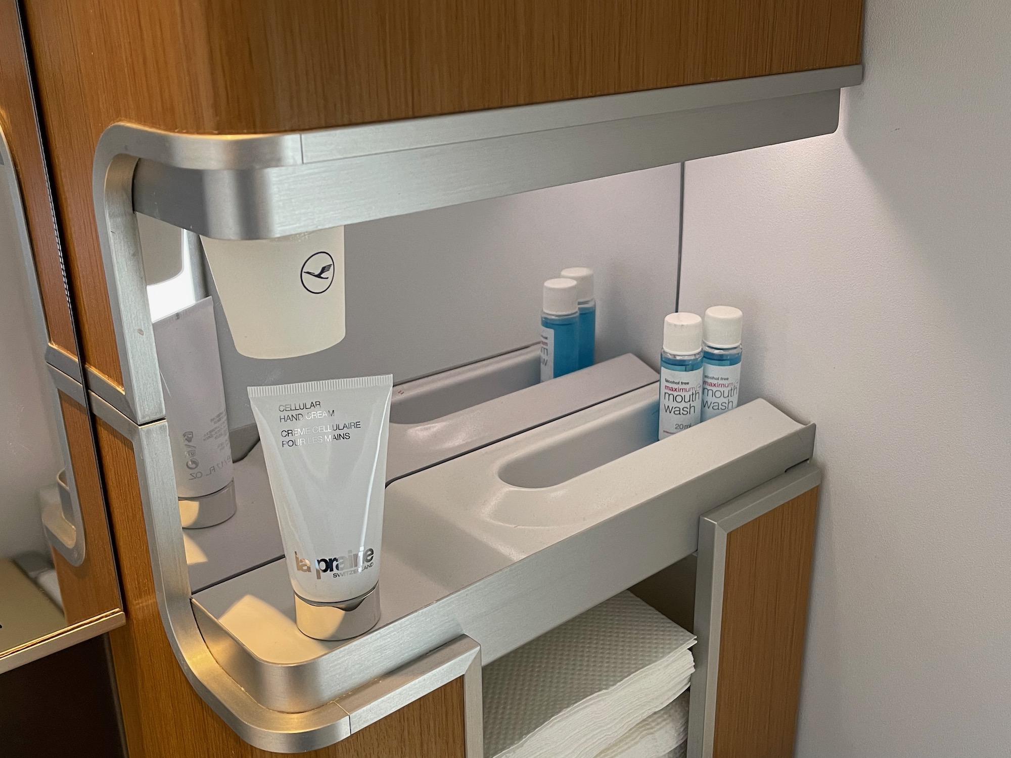 a shelf with a sink and toiletries