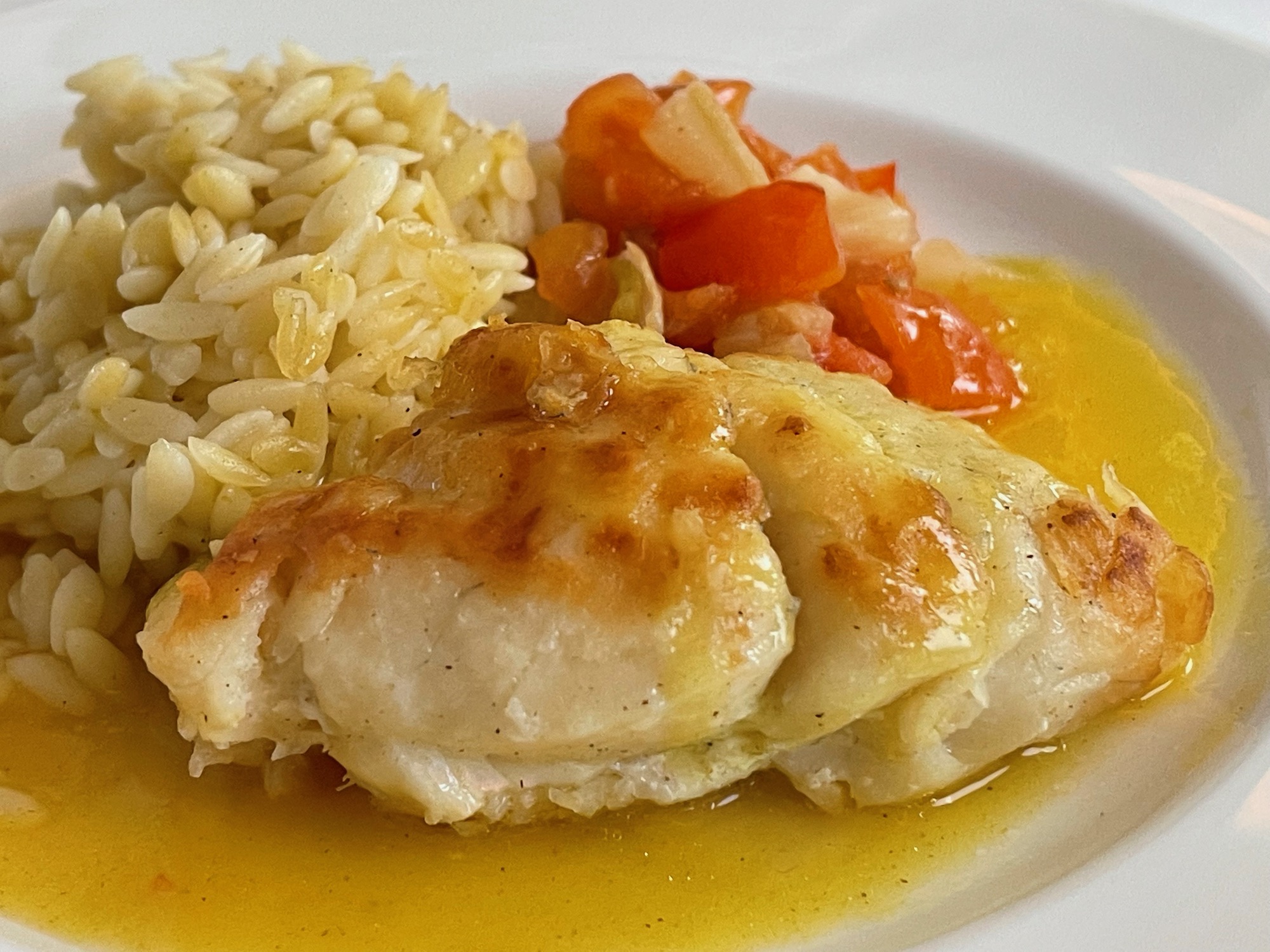 a plate of food with rice and vegetables