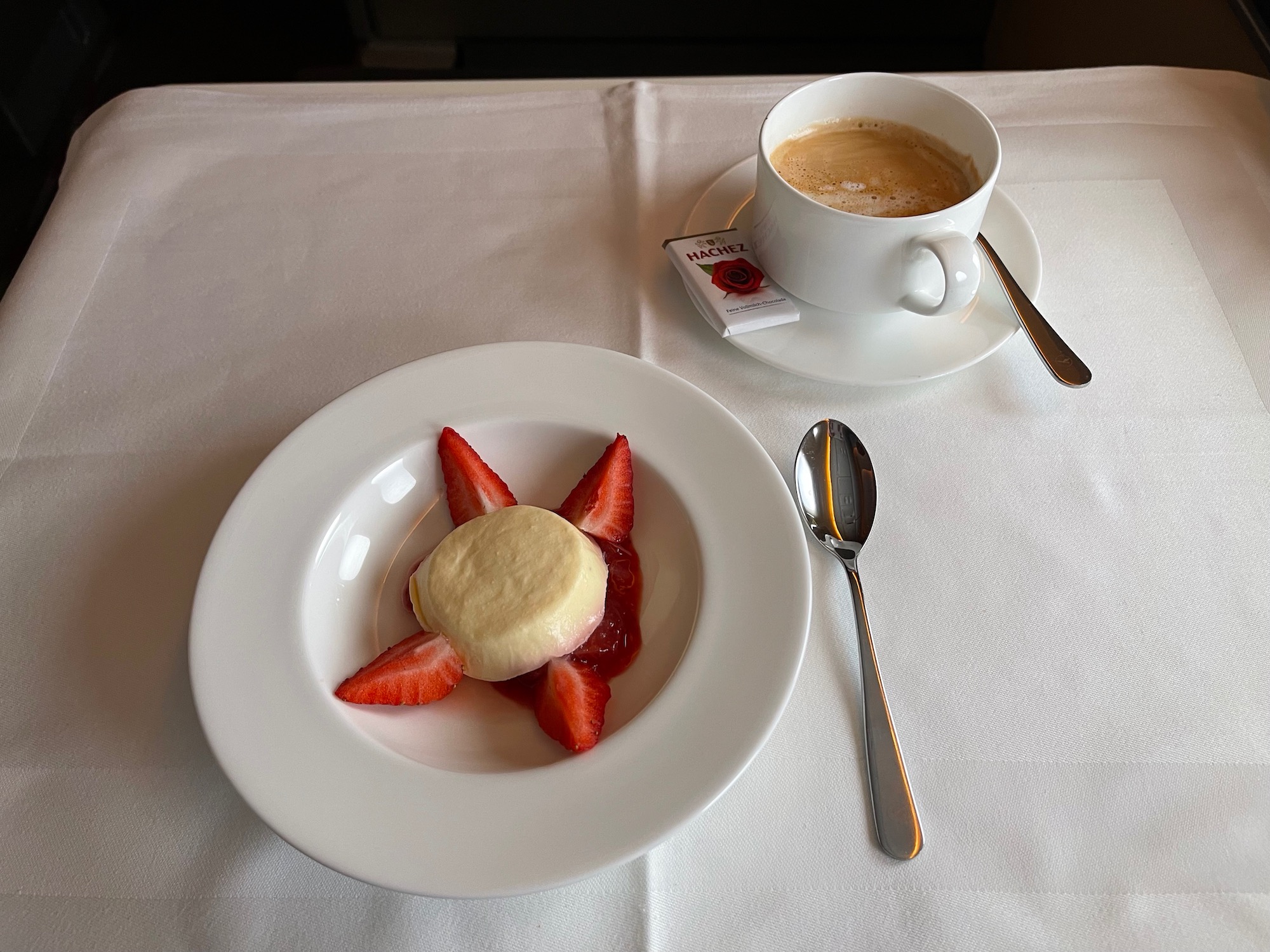 a plate of food and a cup of coffee