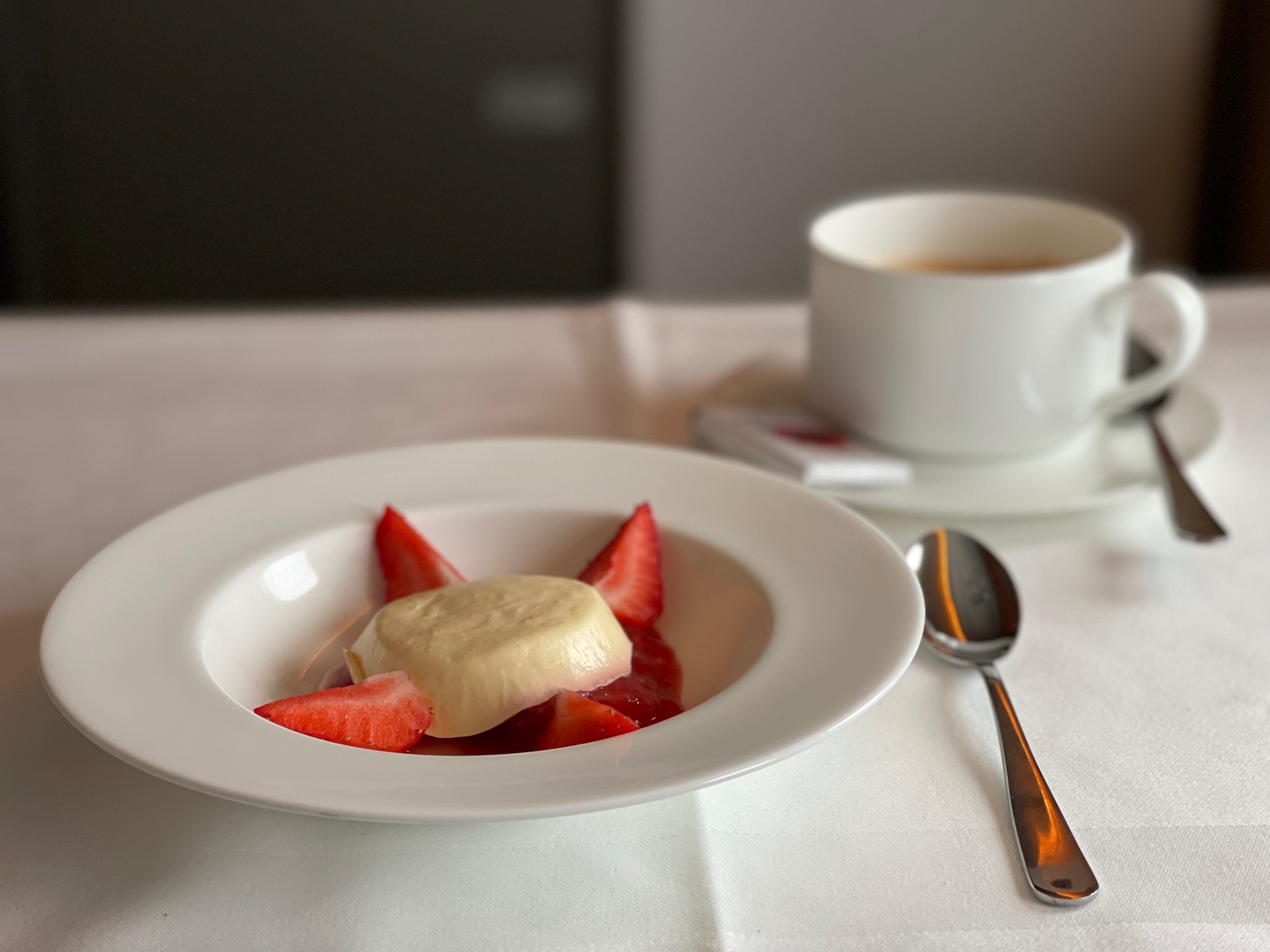 a plate of food and a cup of coffee