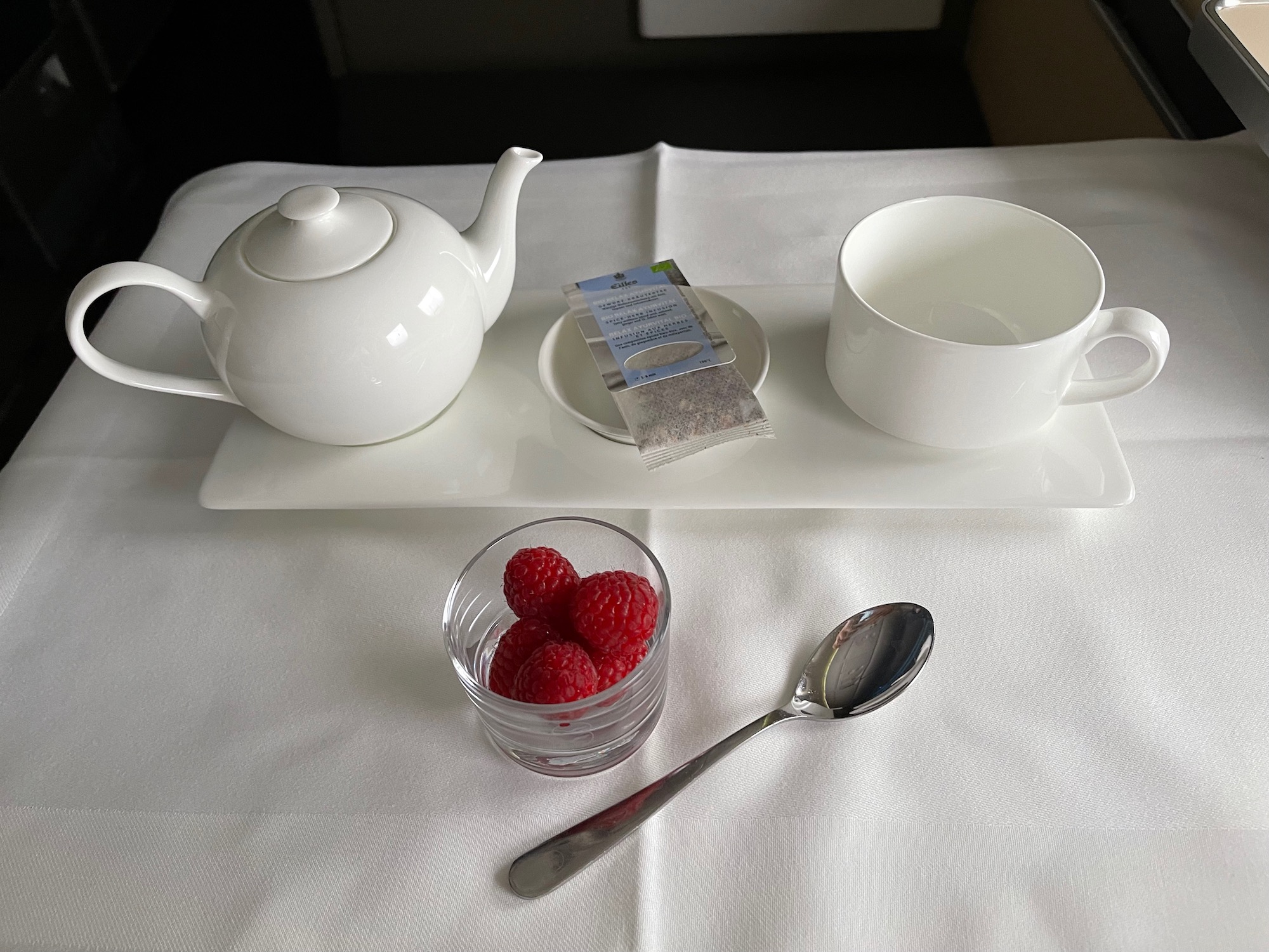 a tea set with a teapot and a cup and a spoon