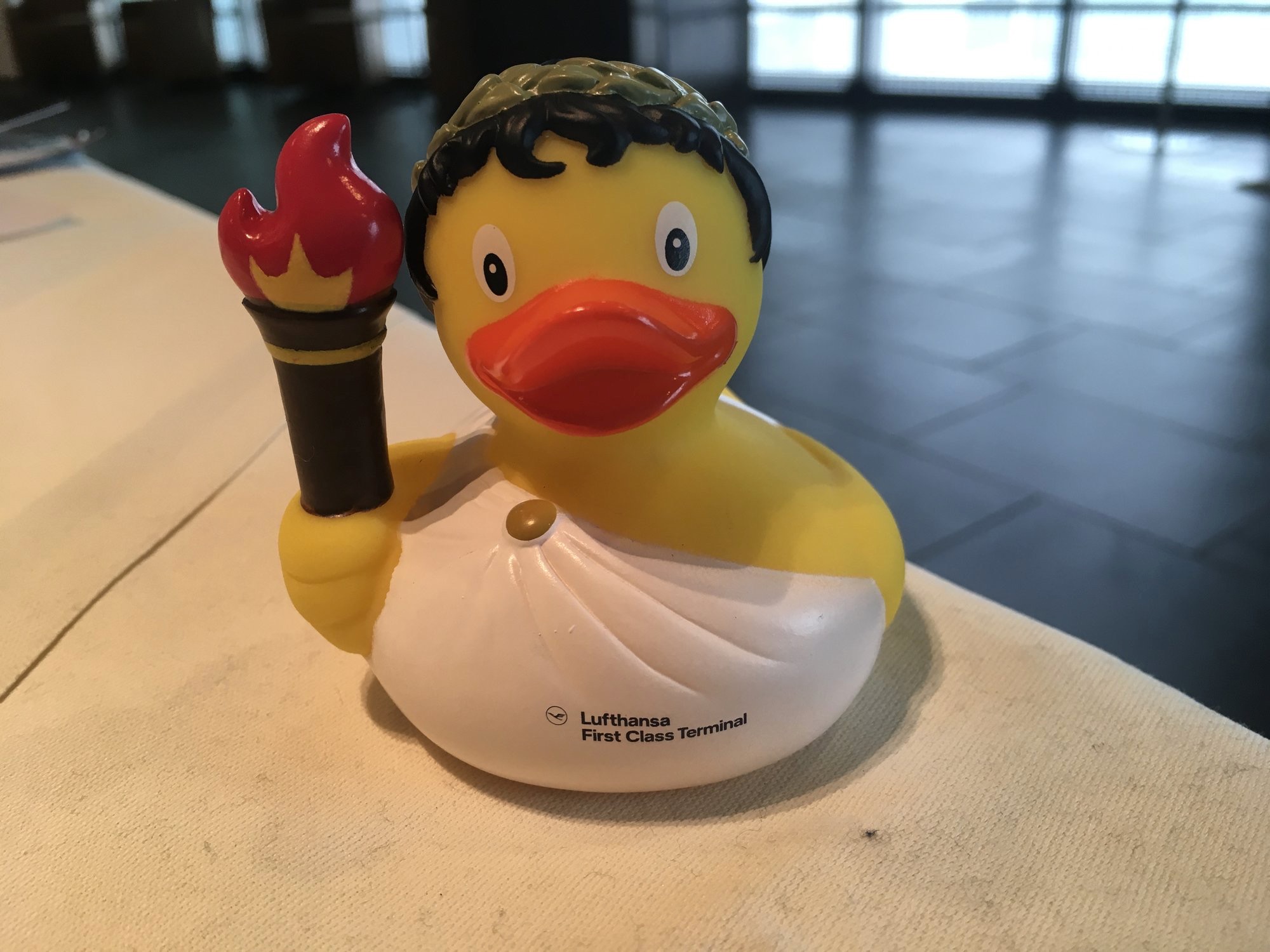 a yellow rubber ducky with a torch