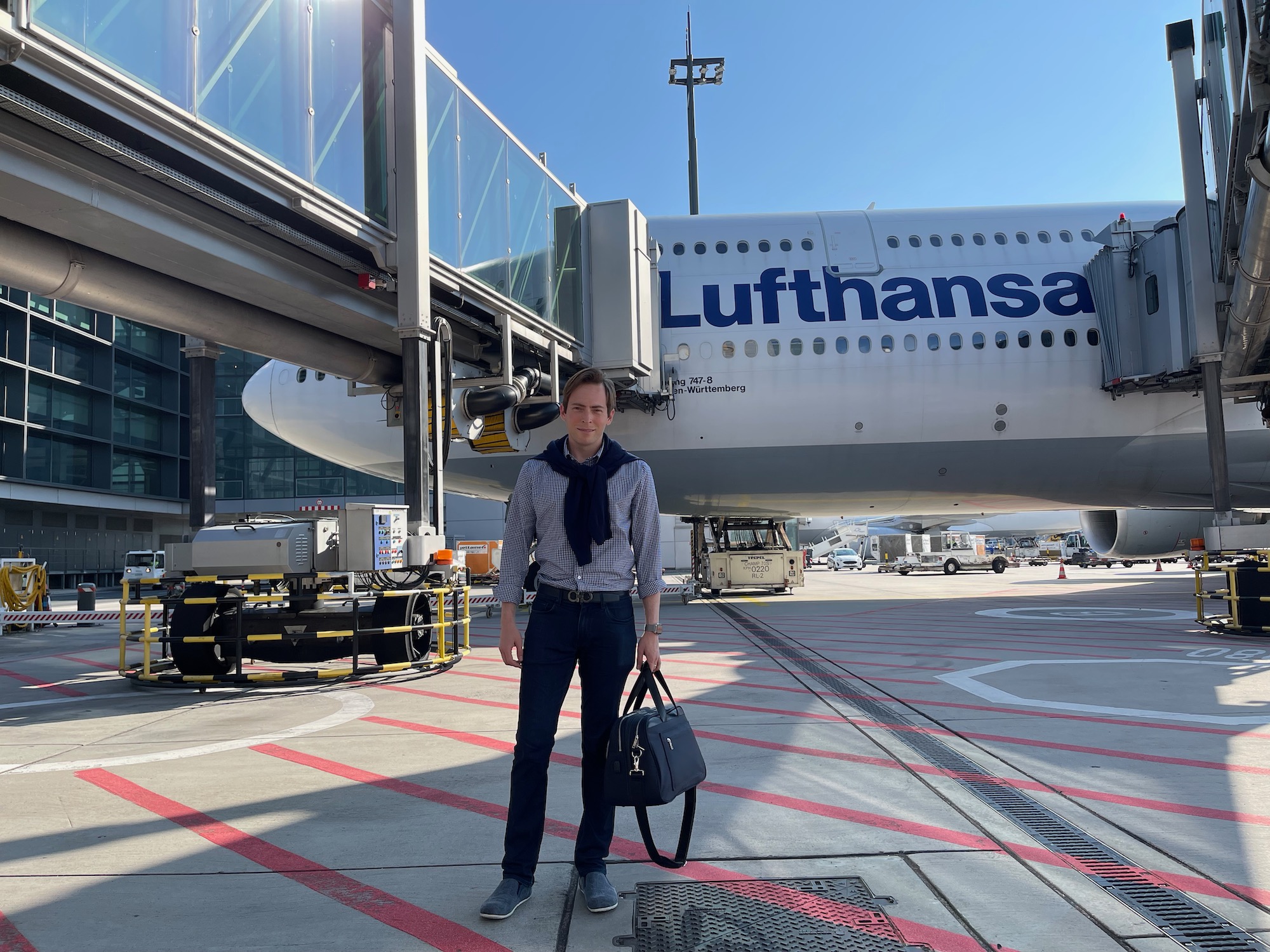 a man standing in front of an airplane