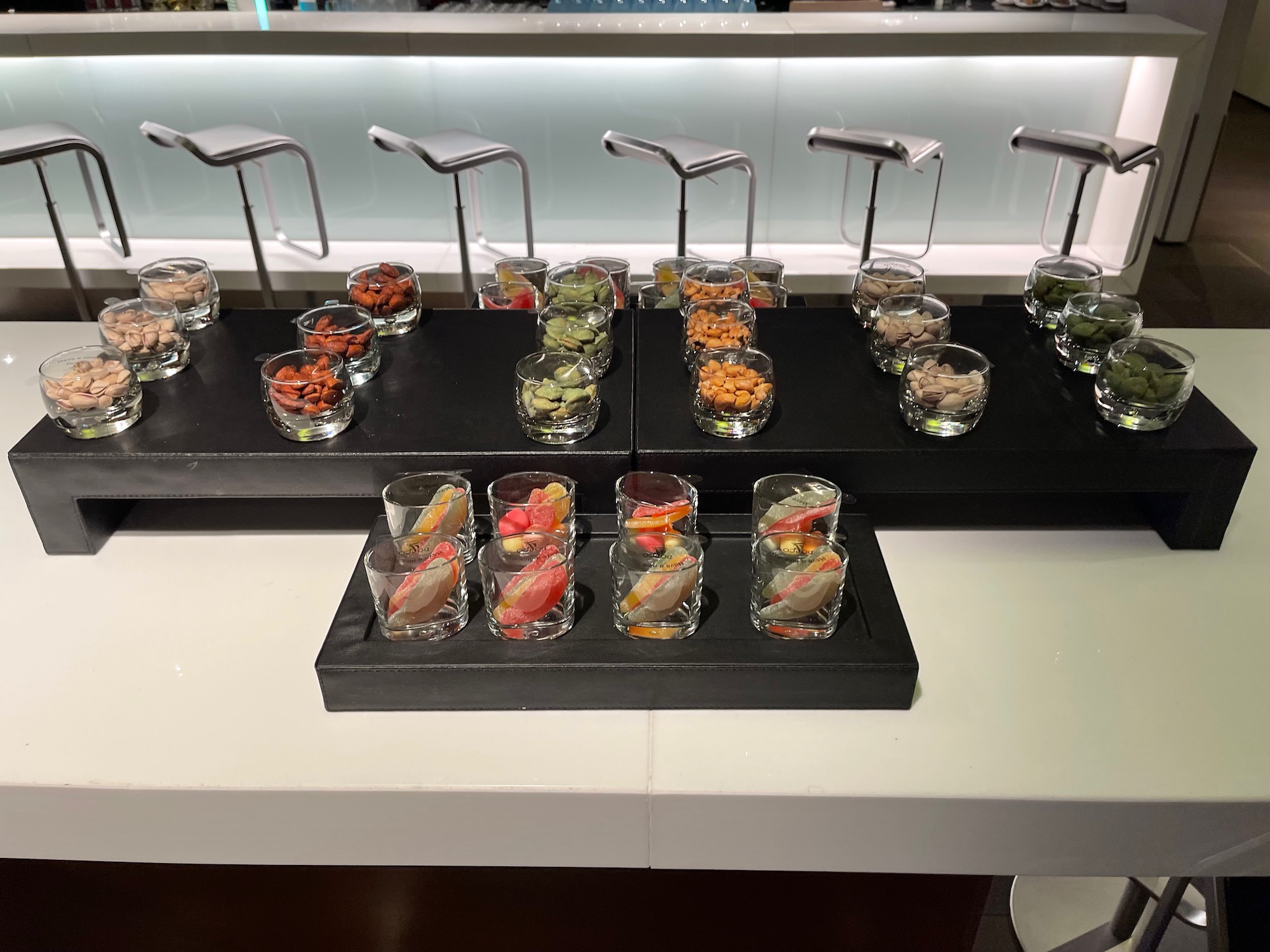 a group of small glasses with different food items on a table